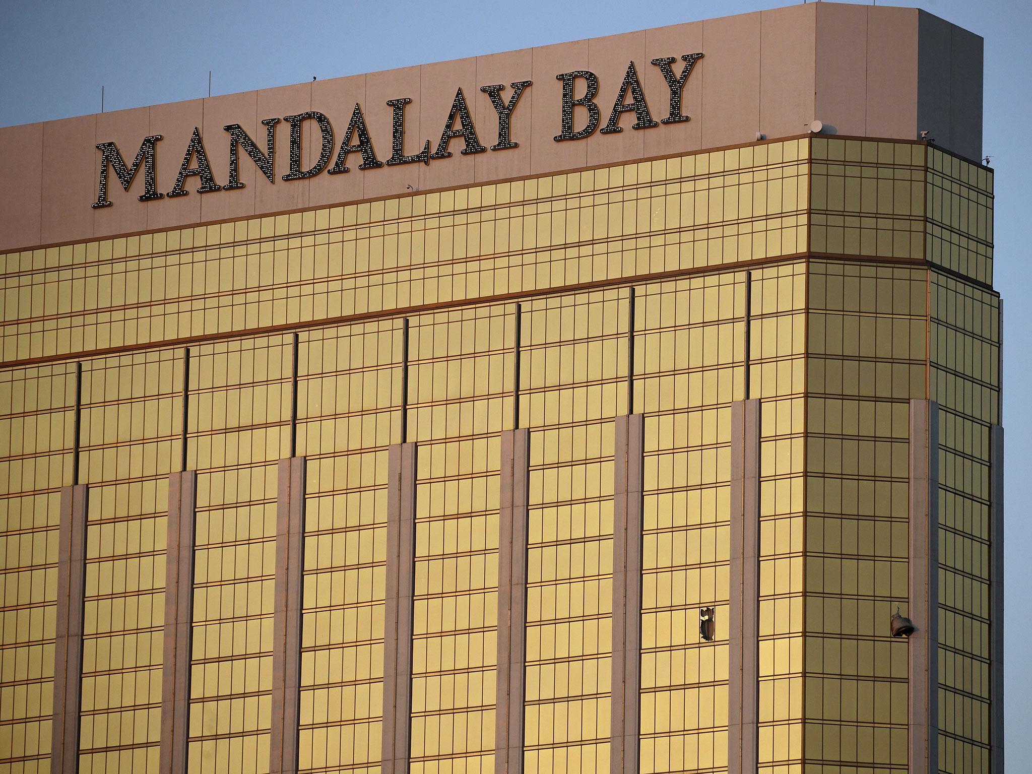 Drapes billow out of broken windows at the Mandalay Bay resort and casino on the Las Vegas Strip, following the deadly shooting at a music festival in Las Vegas