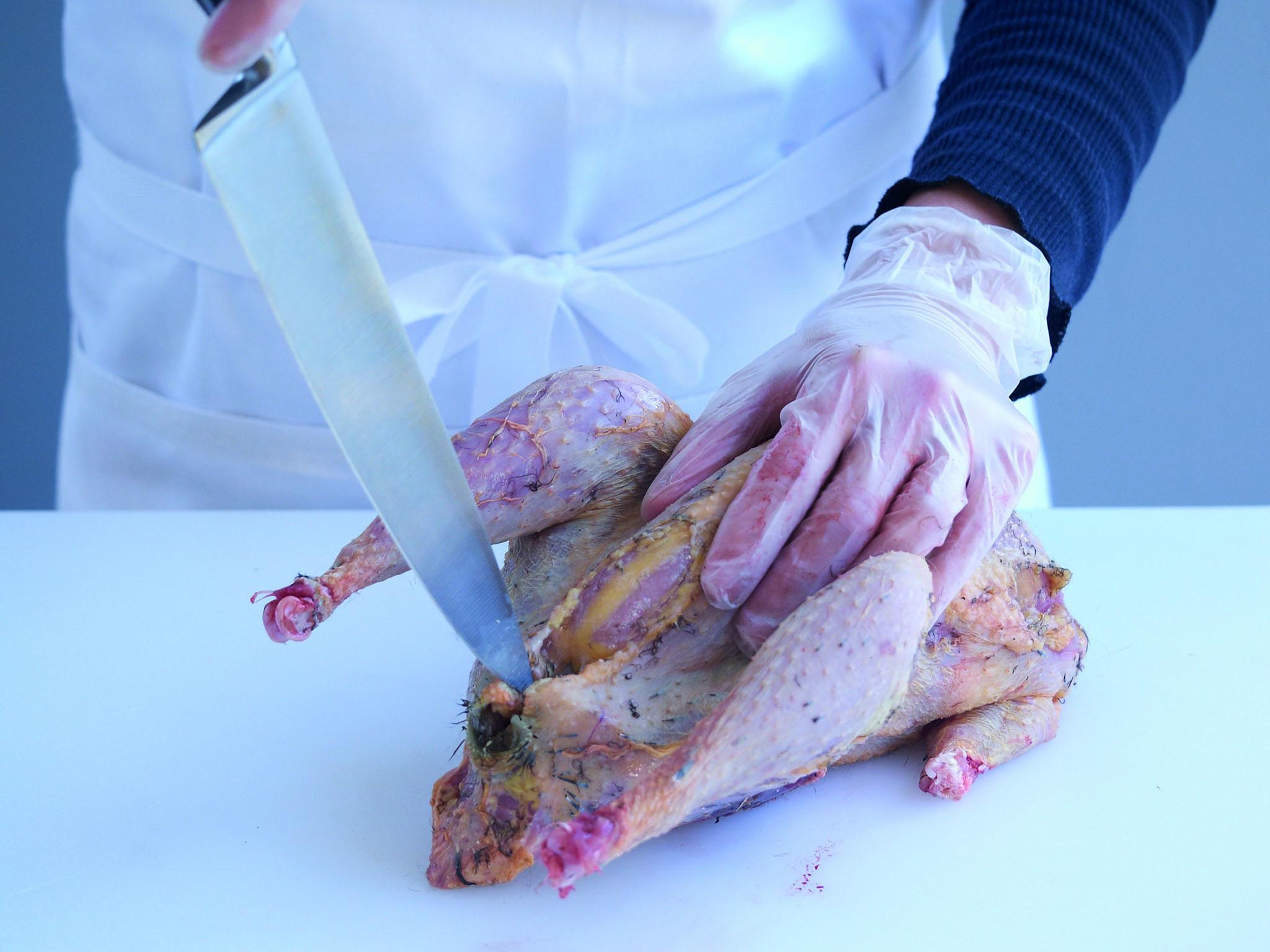 Opening up the vent to allow you to draw the pheasant