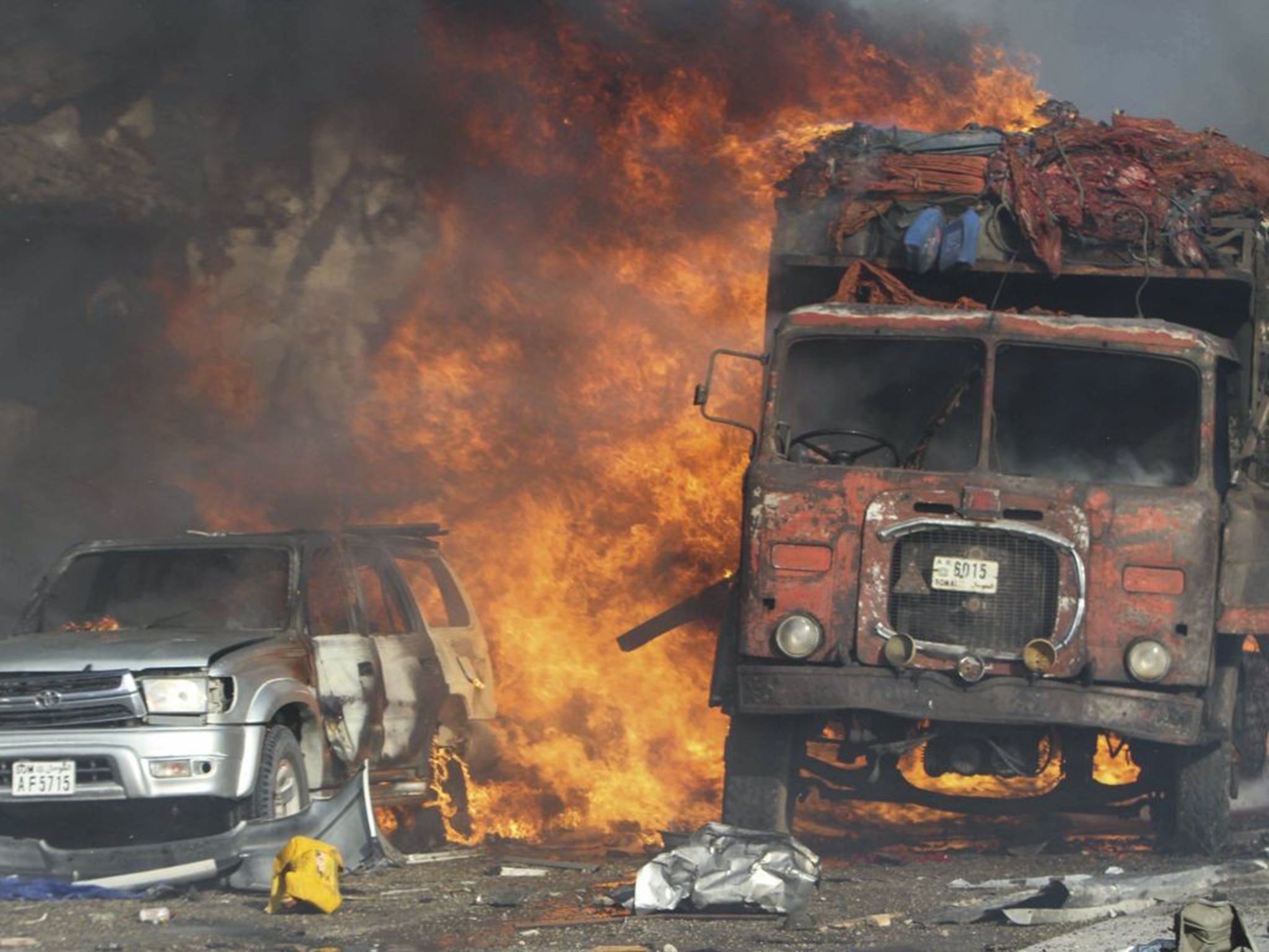 Vehicles burn at the scene of a massive explosion in front of Safari Hotel in the Somali capital Mogadishu