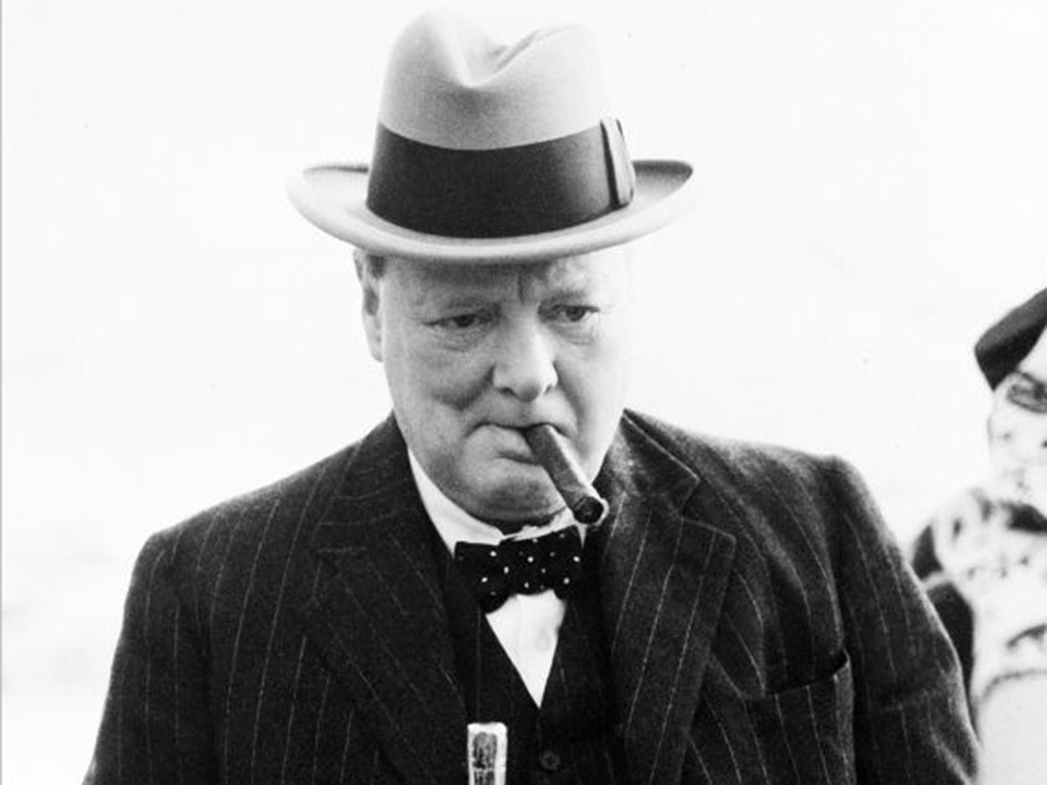 Sir Winston Churchill was rarely seen without a cigar - pictured in 1939