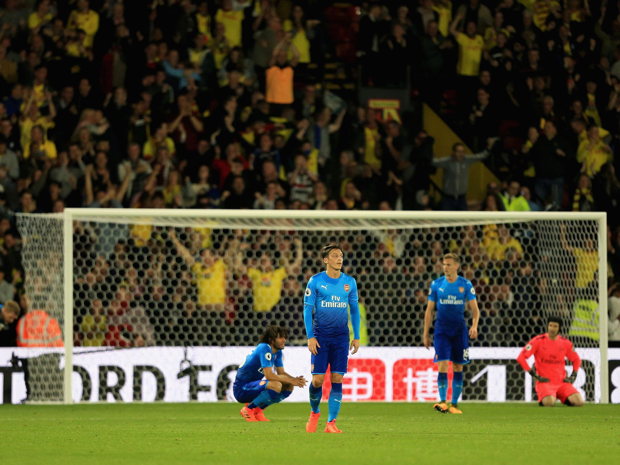 Ozil could only watch on as Arsenal threw away the lead at Vicarage Road