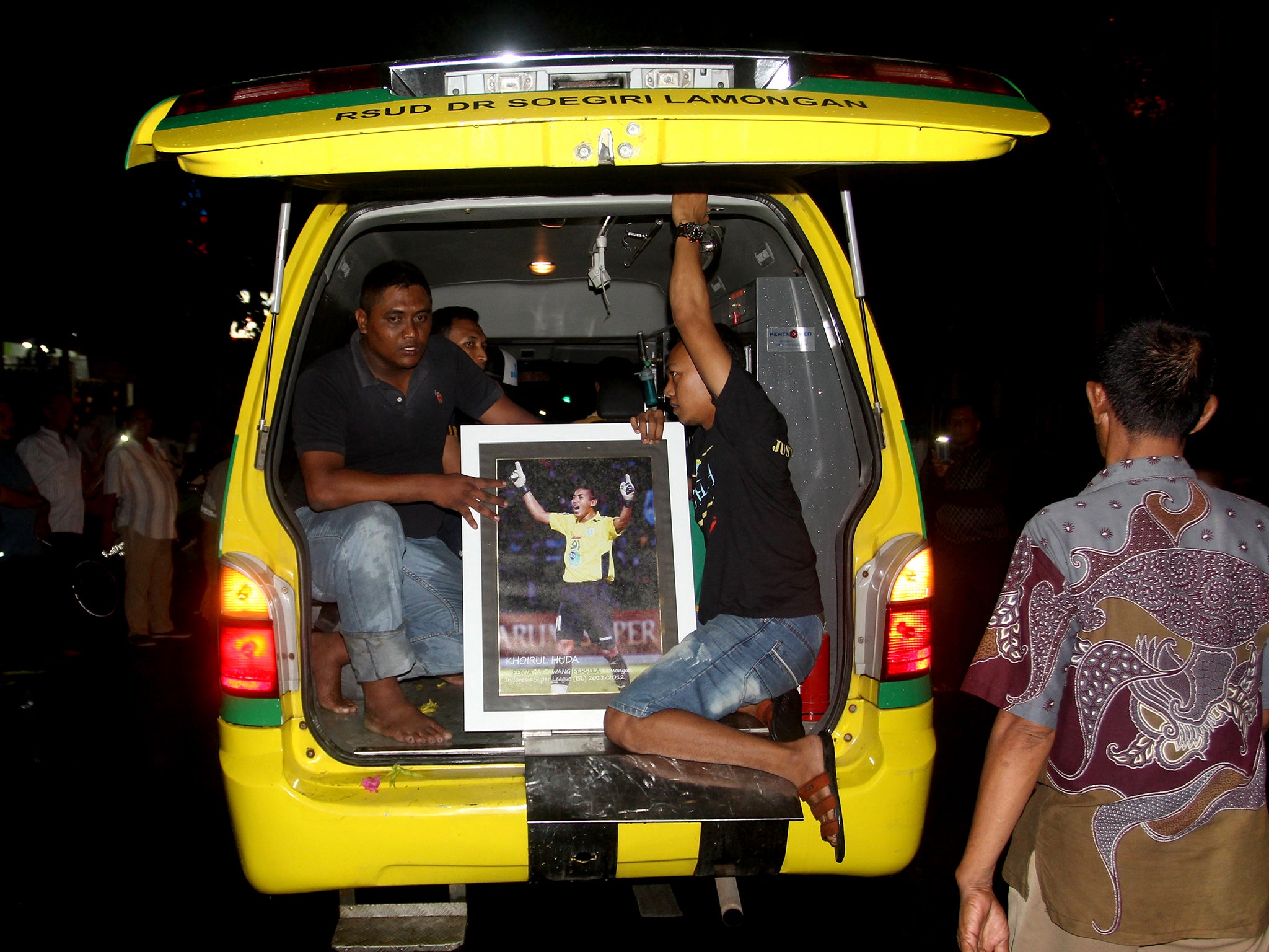 Huda's body is taken away from hospital in a hearse as fans pay tribute to the late goalkeeper