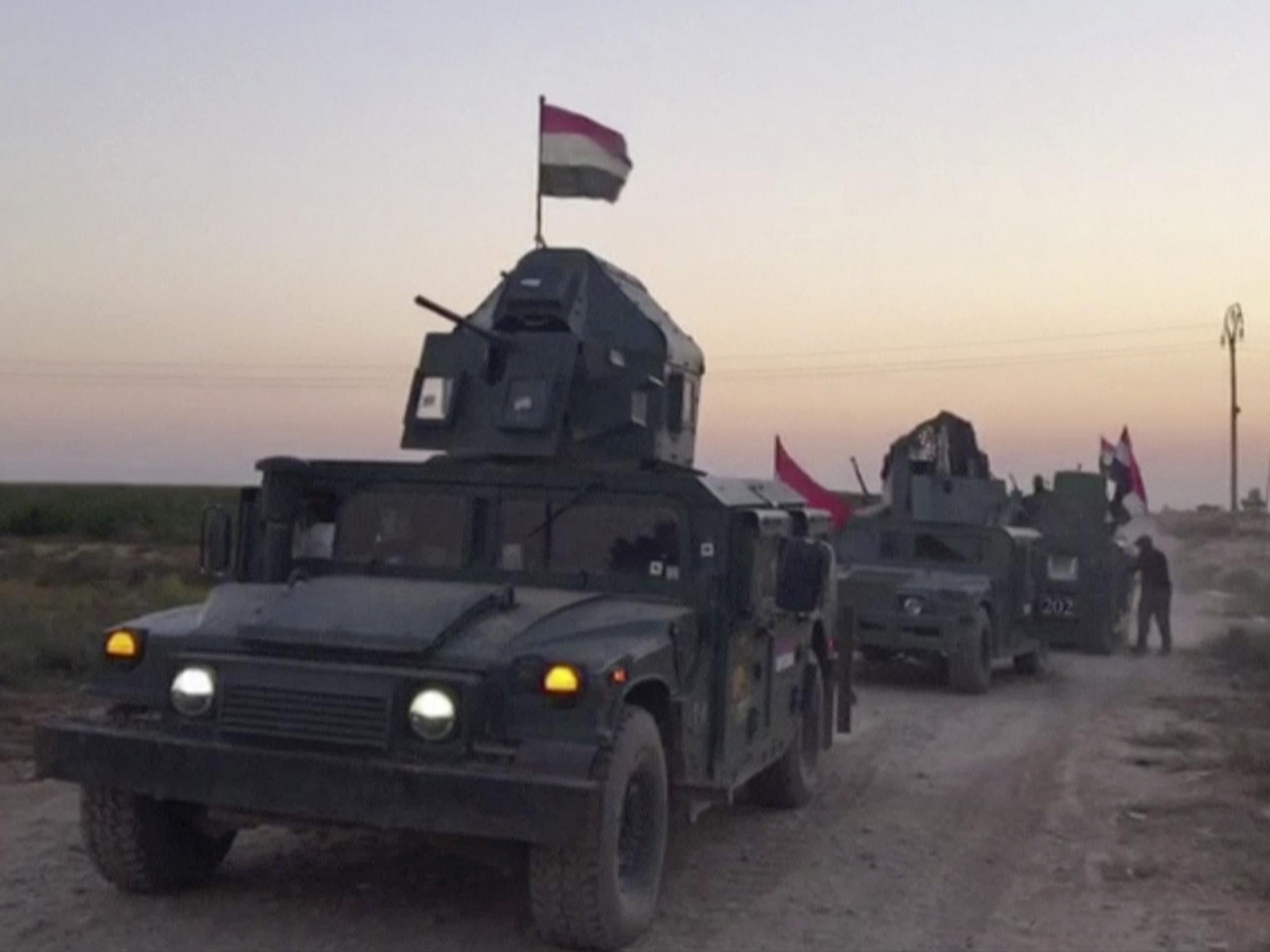 Iraqi soldiers on military vehicles in the Qatash area towards Kirkuk gas plant, south of Kirkuk