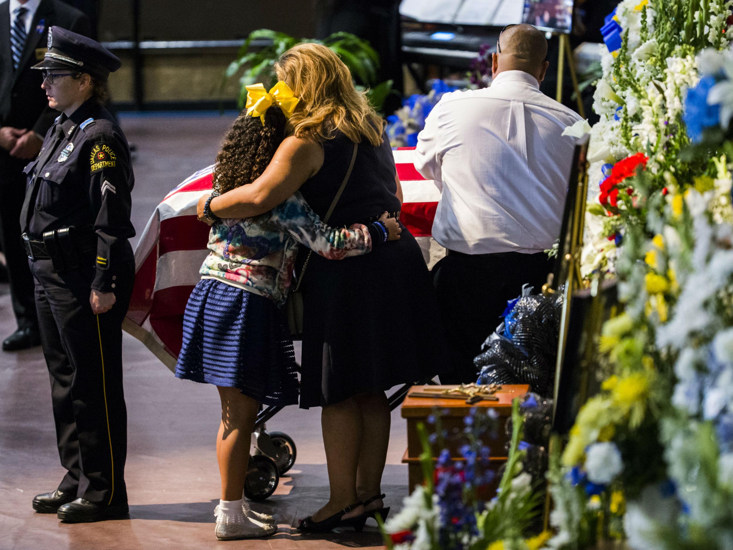 Mourners at a funeral service for a police officer who was among five police officers shot dead the previous week, in Fort Worth, Texas, on July 16, 2016.