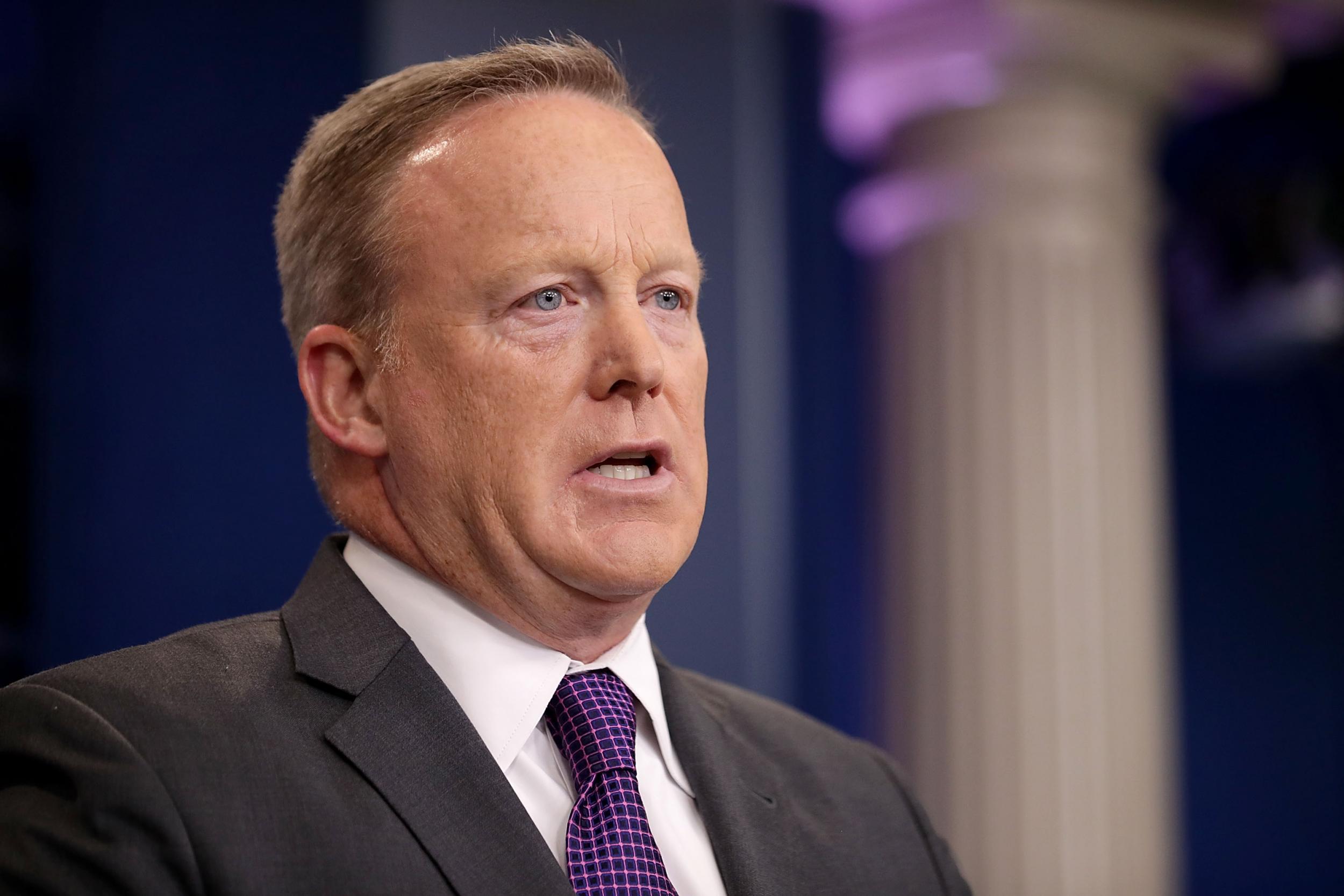 Former White House Press Secretary Sean Spicer speaks to reporters during an off-camera briefing