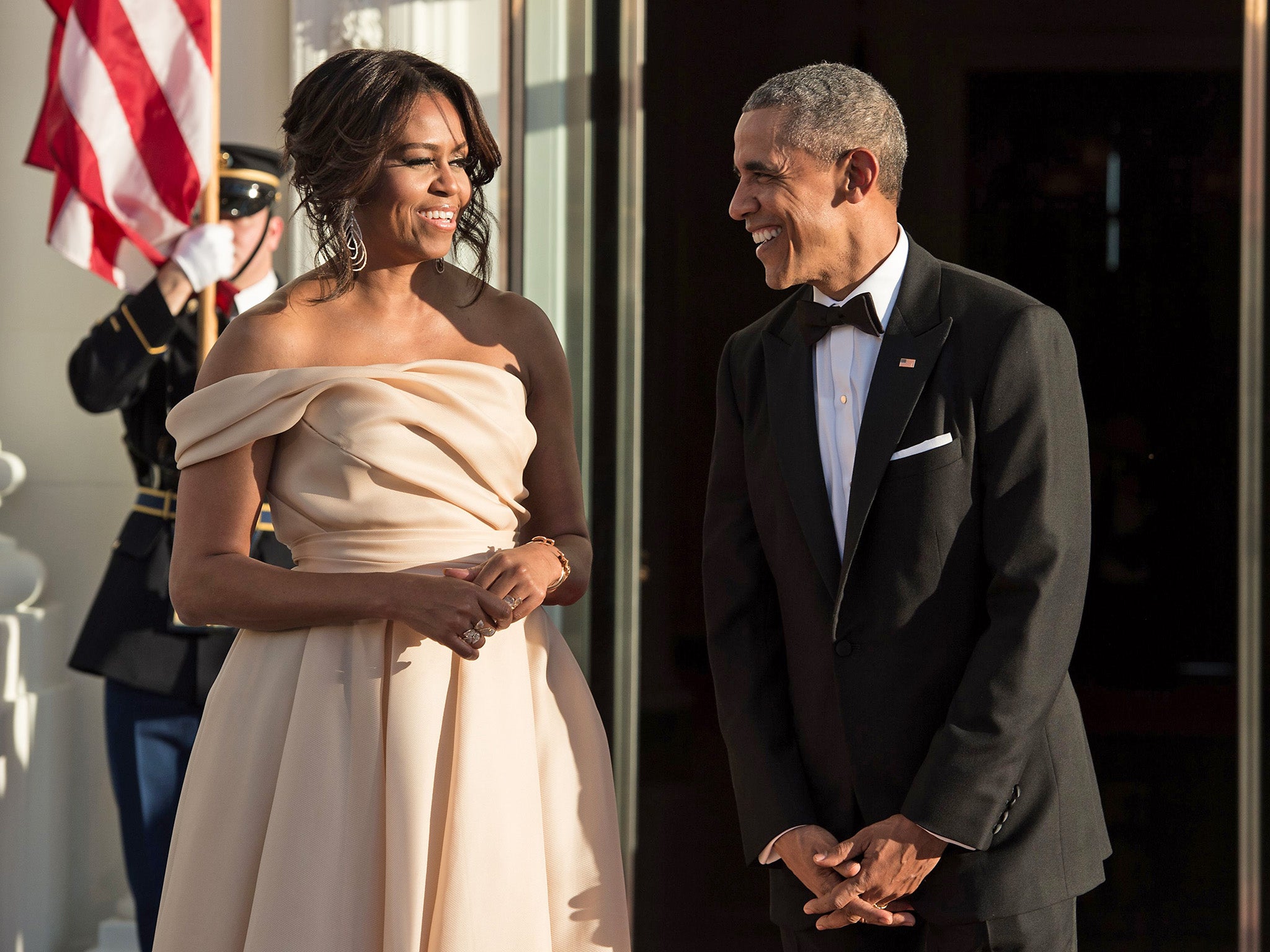 Michelle and Barack Obama wait for the leaders of five Nordic countries to arrive for a state dinner in 2016