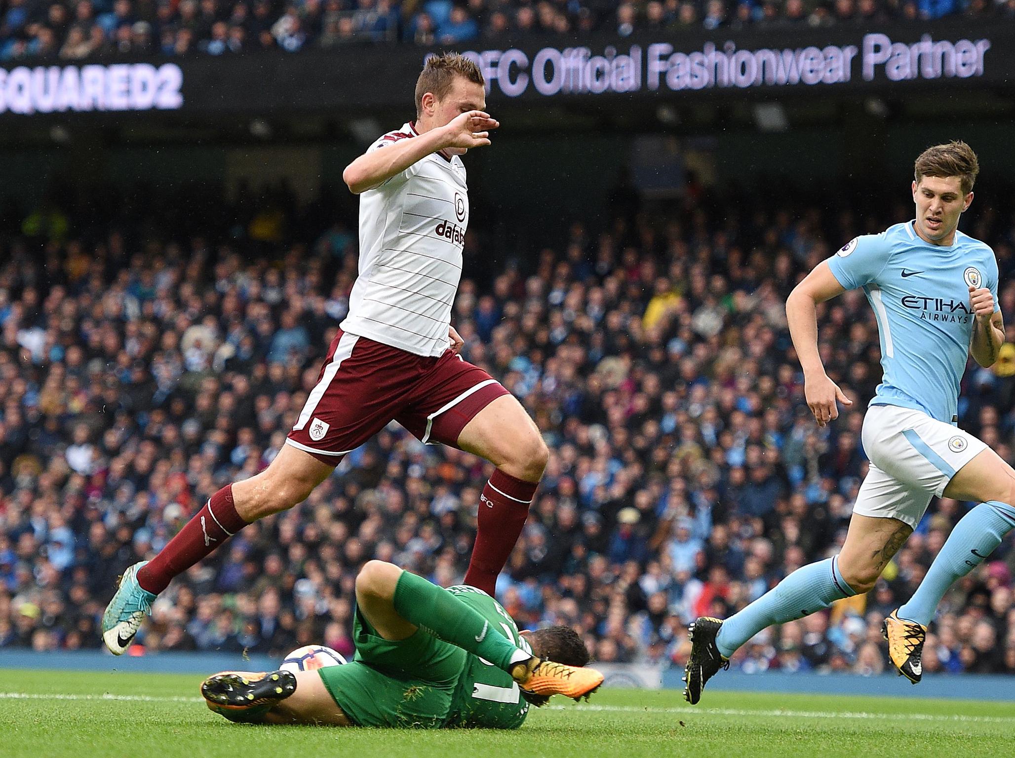 Ederson diving to deny Wood