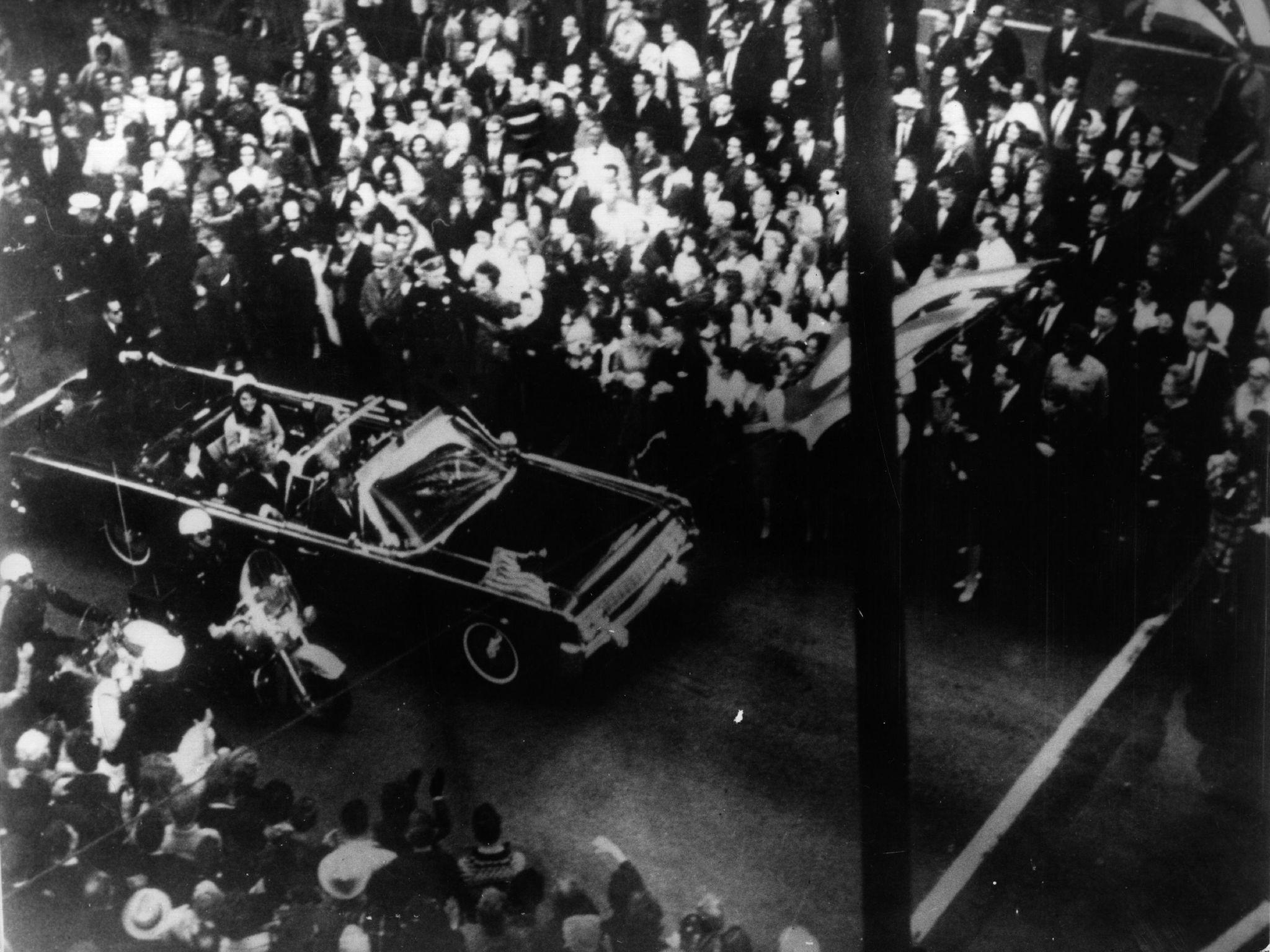 22nd November 1963: US statesman John F Kennedy, 35th president of the US, and his wife Jackie Kennedy travelling in the presidential motorcade at Dallas, before his assassination.