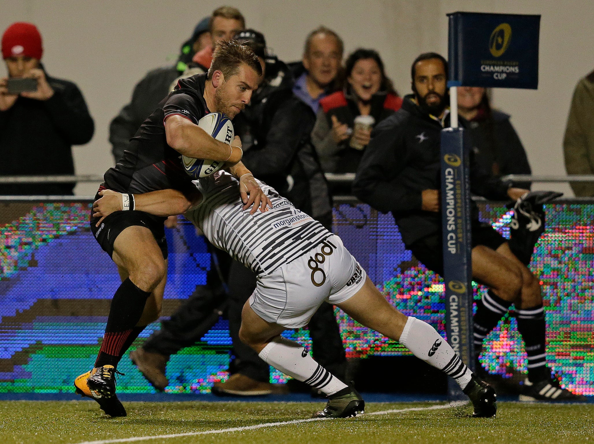 Chris Wyles of Saracens powers his way across the line