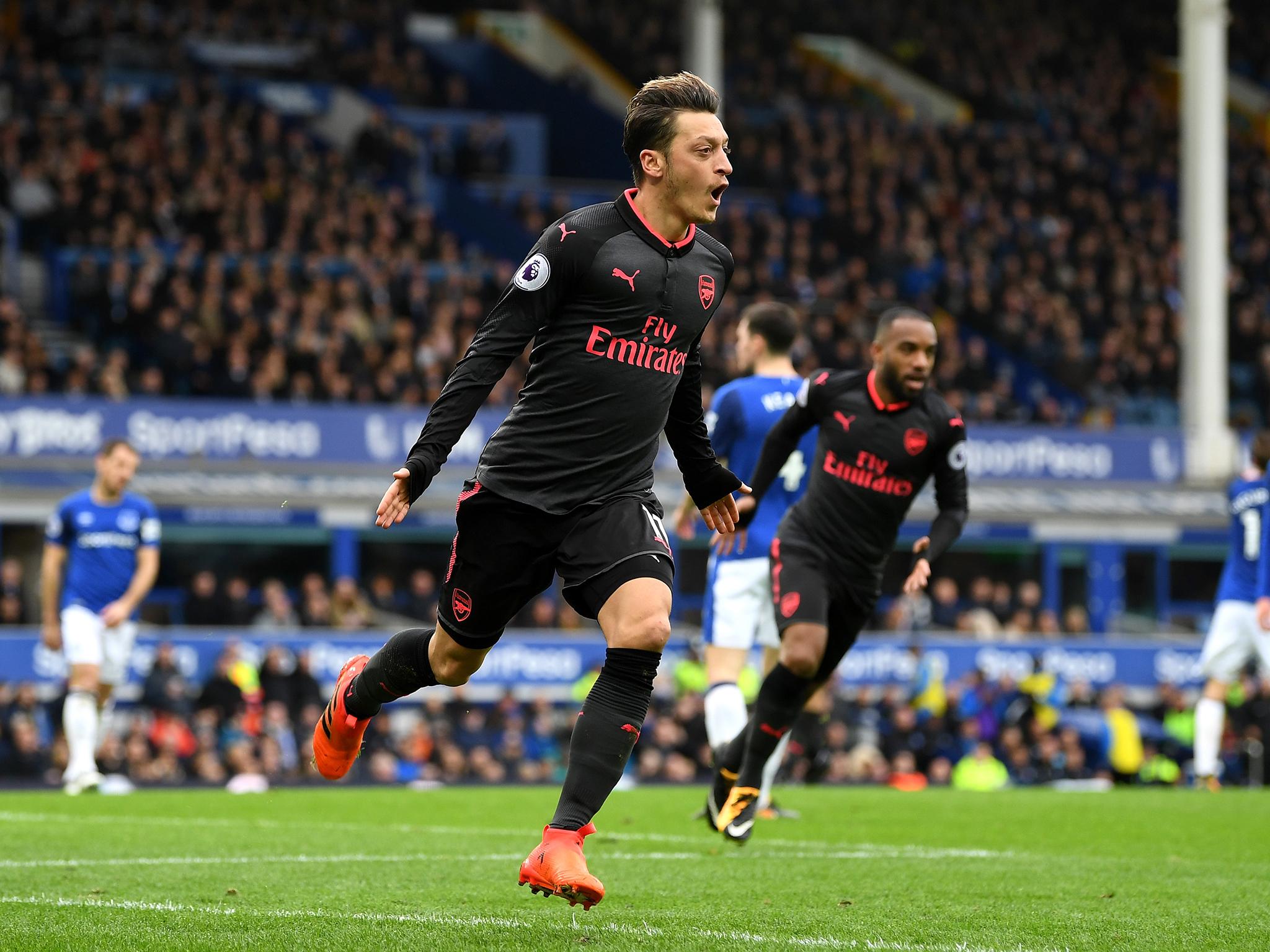 Mesut Özil celebrates scoring Arsenal's second goal against Everton