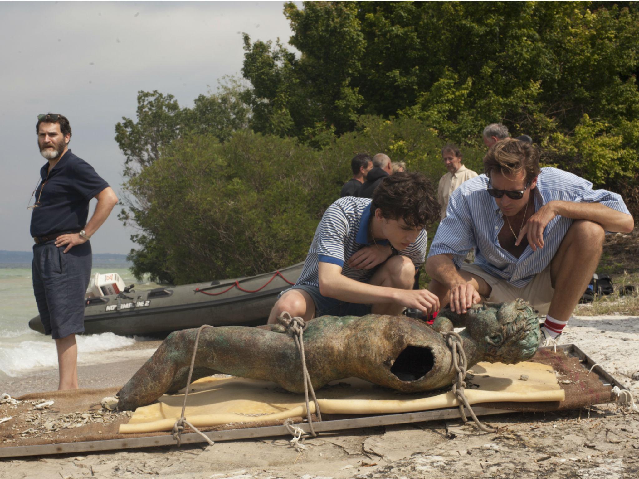 Michael Stuhlbarg as Mr Perlman (left), Chalamet as Elio (centre) and Hammer as Oliver