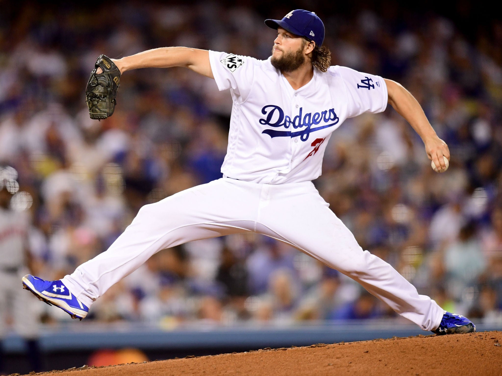 Clayton Kershaw of the Los Angeles Dodgers pitches during the seventh inning of game one of the World Series