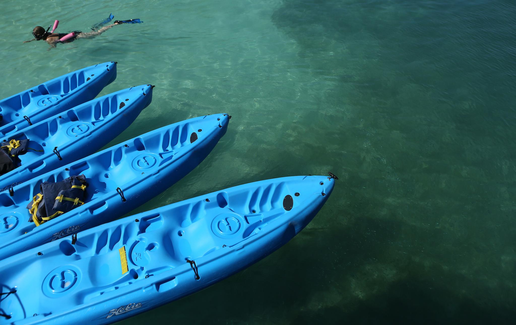 A tourist snorkels in clear waters near a reef July 15, 2013 offshore from Hamilton, Bermuda