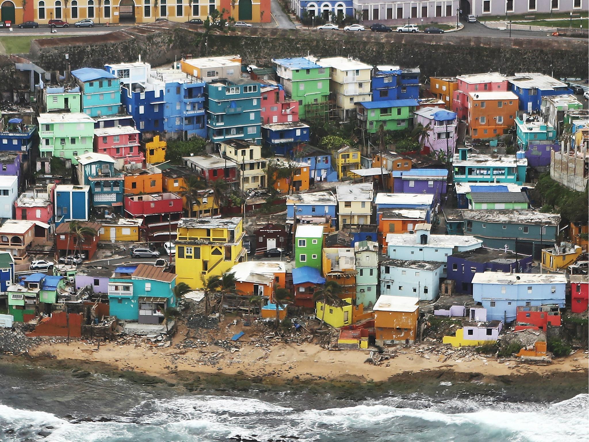 The damaged La Perla neighbourhood is viewed from the air during recovery efforts four weeks after Hurricane Maria struck on 18 October 2017.