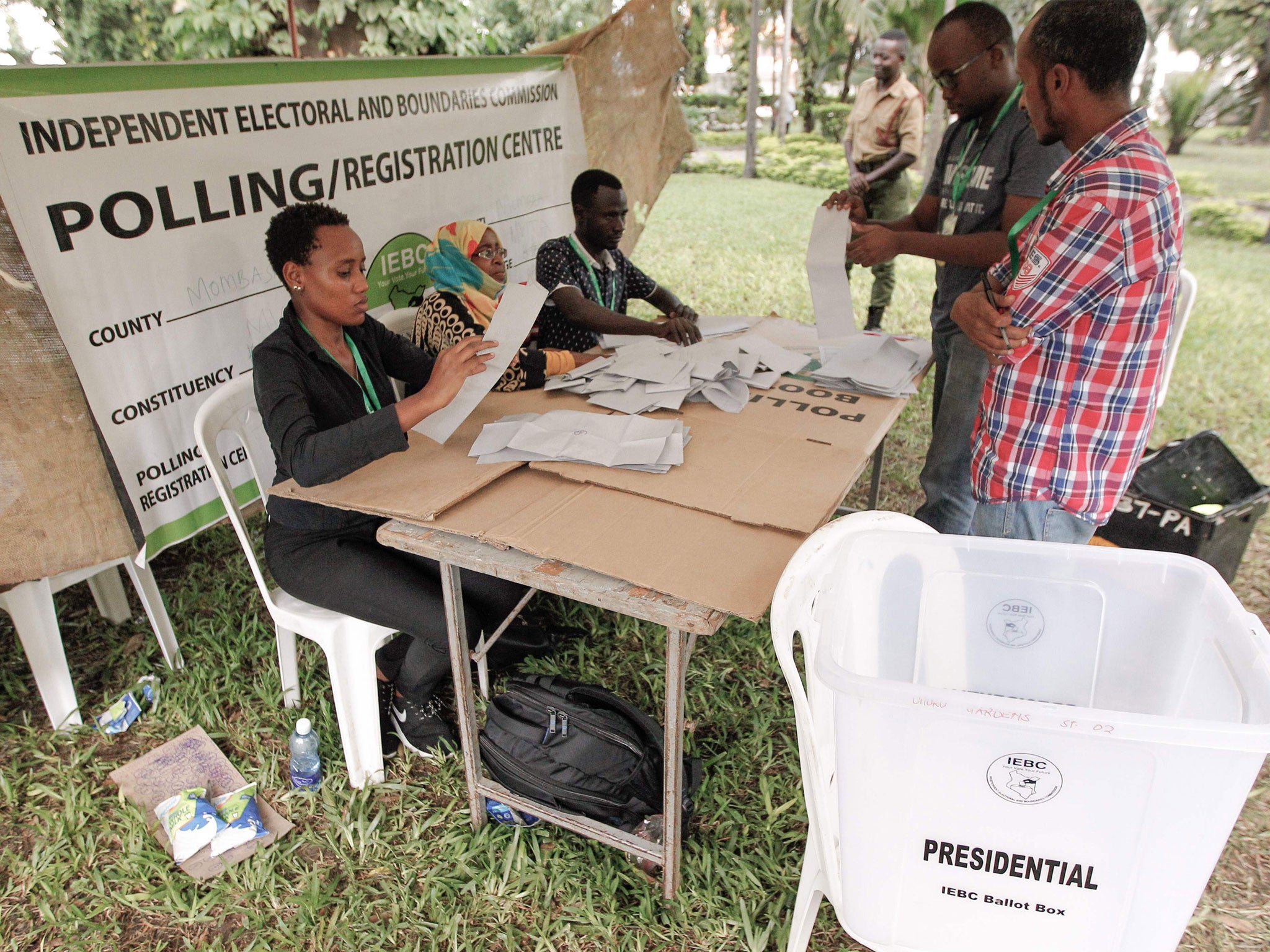 Officials count ballots at a polling station in Mombasa in the presidential rerun