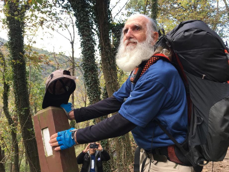 Dale Sanders, 82, stopped to kiss his last trail marker before becoming the oldest person to hike all 2,190 miles of the Appalachian Trail within a year.