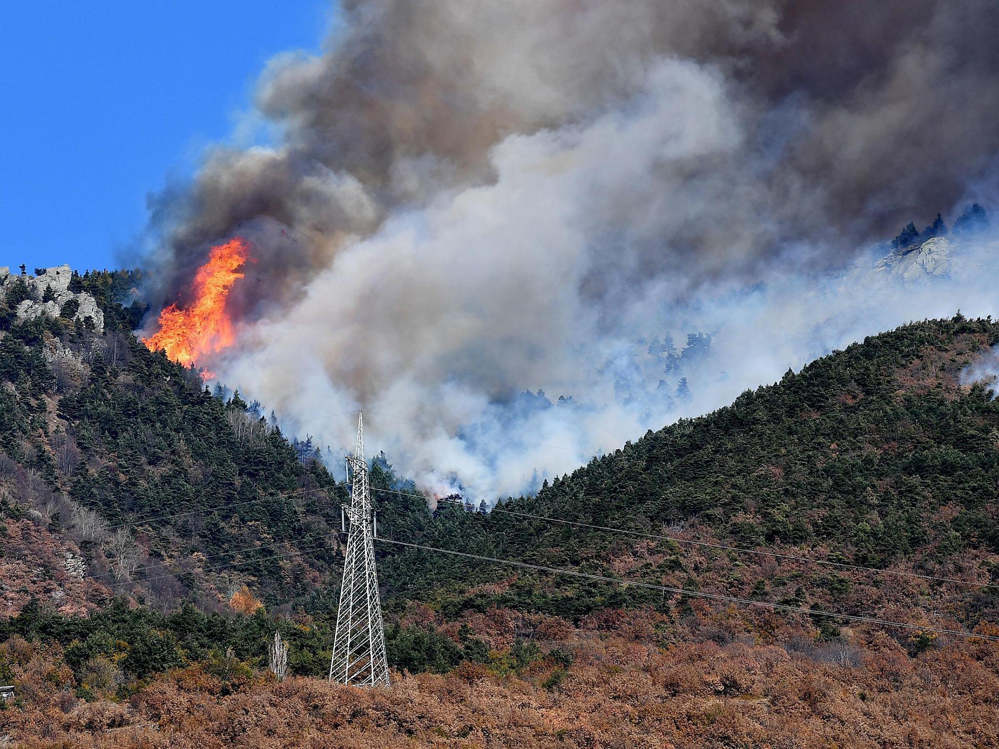 Uncontrolled blazes fueled by weather, wind, and dry underbrush spread in the Val di Susa region, about 30 kilometres west of the Piedmont capital Turin