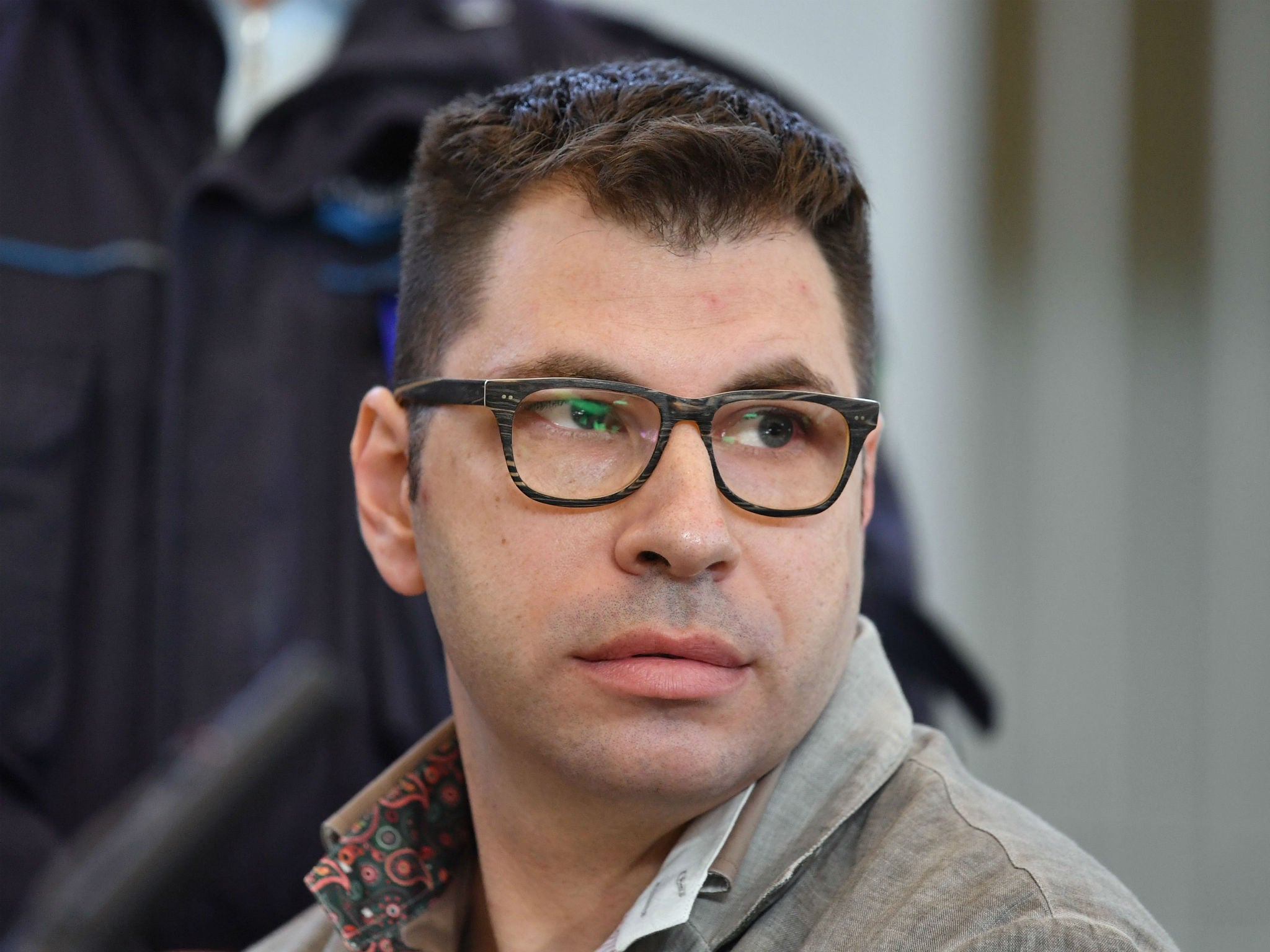 Valentino Talluto looks on during his trial in the courtroom of the Rebibbia prison