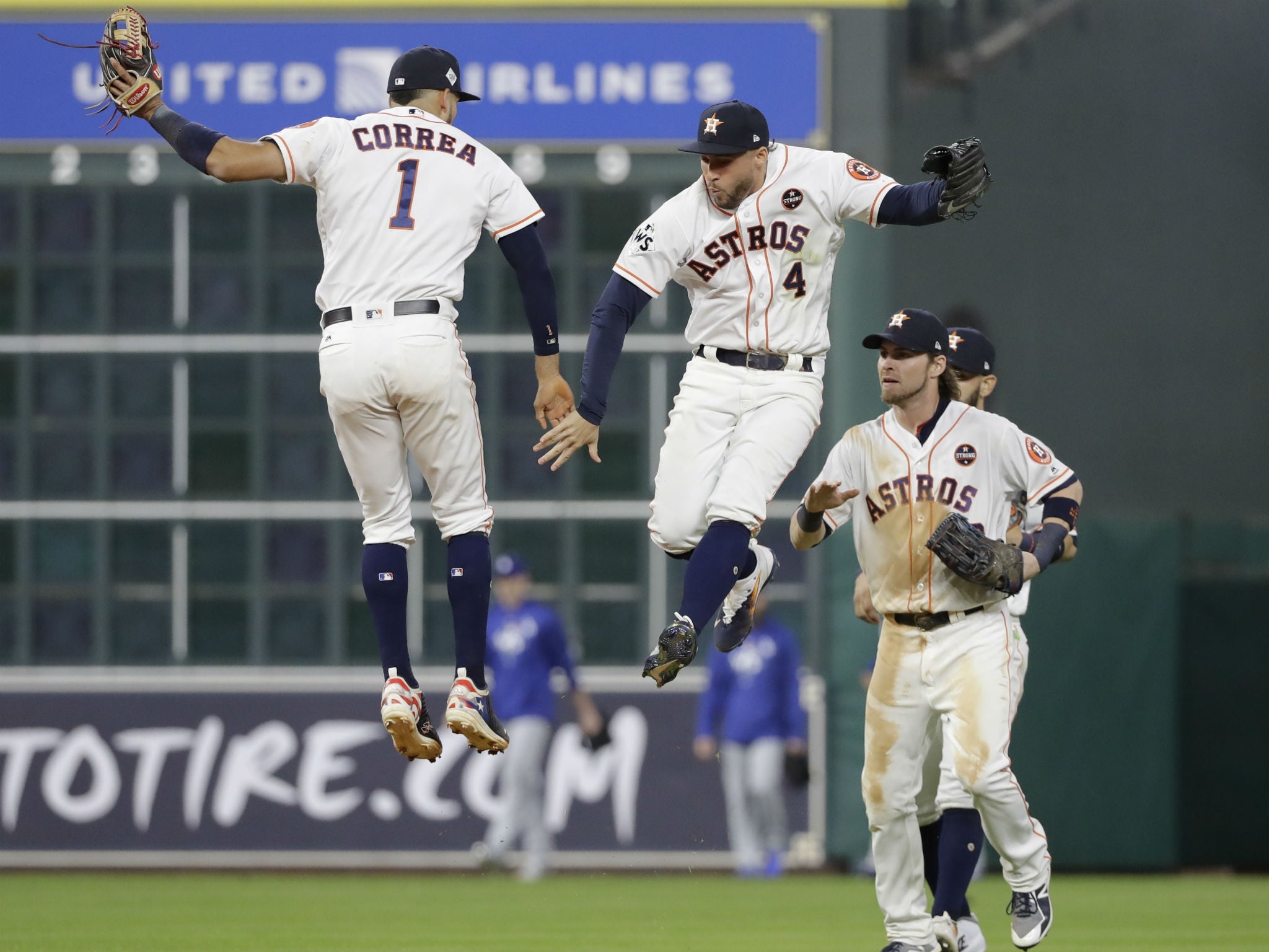 Houston Astros' Carlos Correa and George Springer celebrate winning Game 3 of the World Series