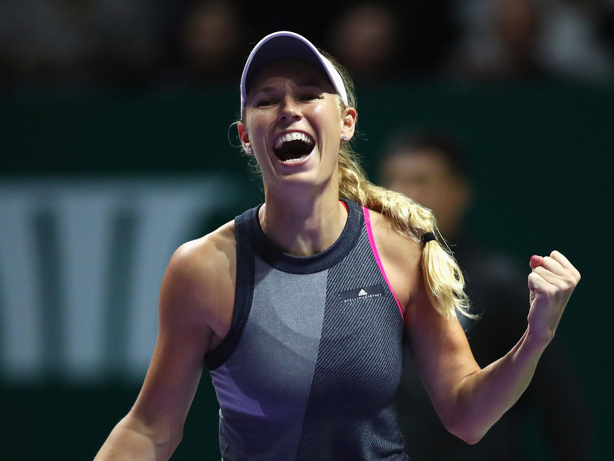 Caroline Wozniacki celebrates after booking her spot in the final