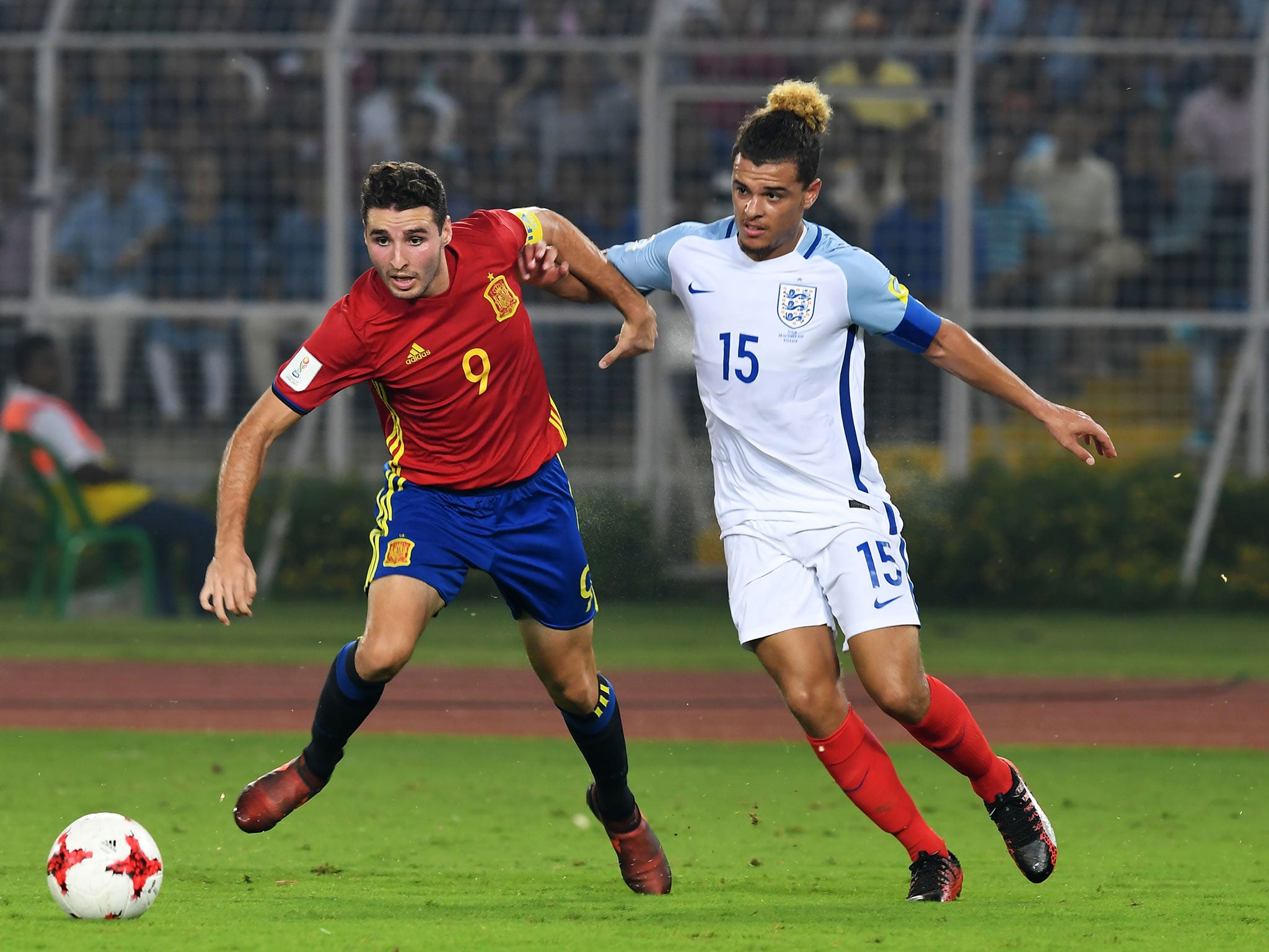 Spain captain Abel Ruiz jostles with England skipper Joel Latibeaudiere