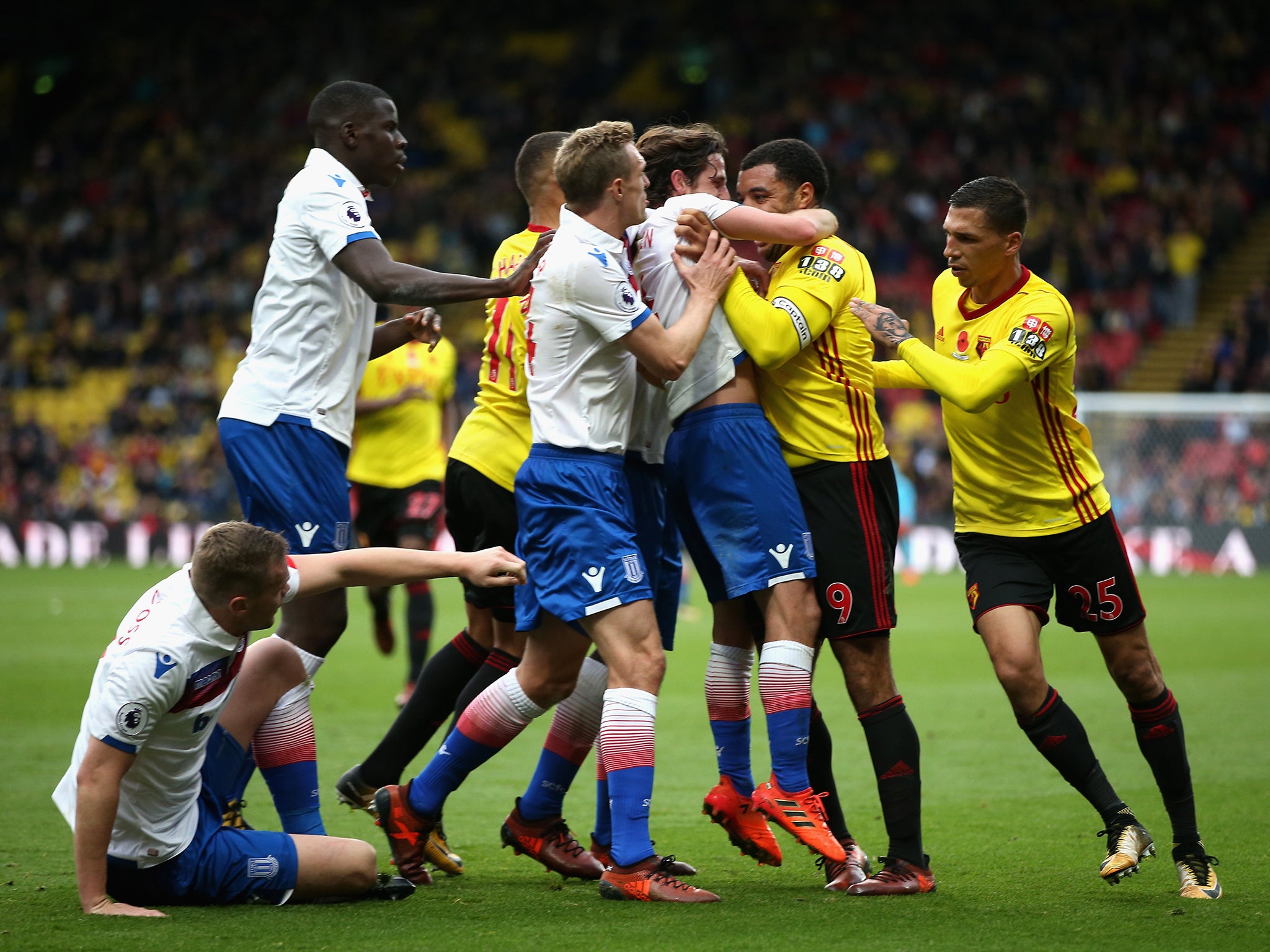 Joe Allen and Troy Deeney clash late in the match