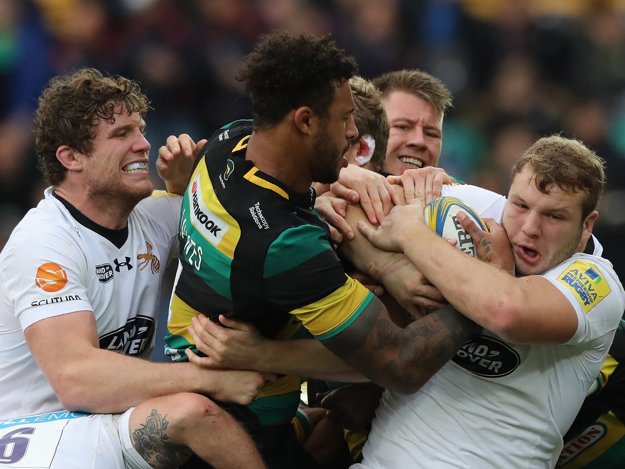 Courtney Lawes wrestles for the ball with England teammate Joe Launchbury