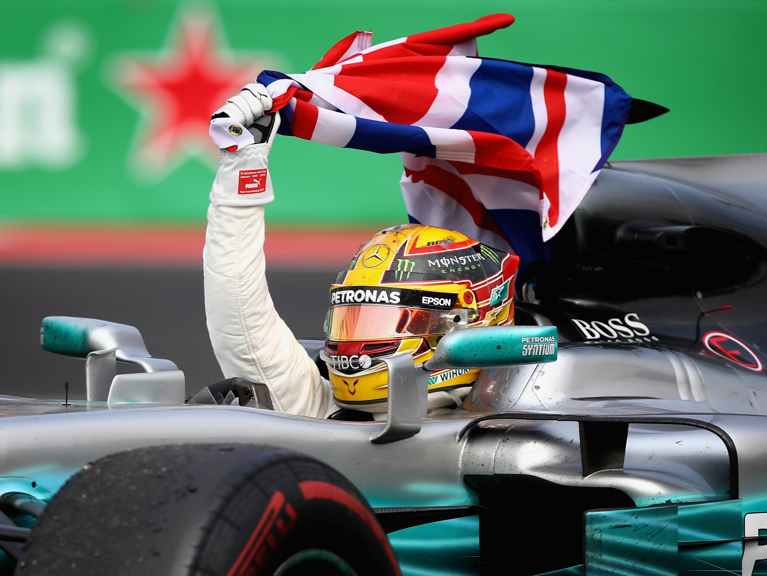 Hamilton celebrates his success from the cockpit of his championship-winning Mercedes