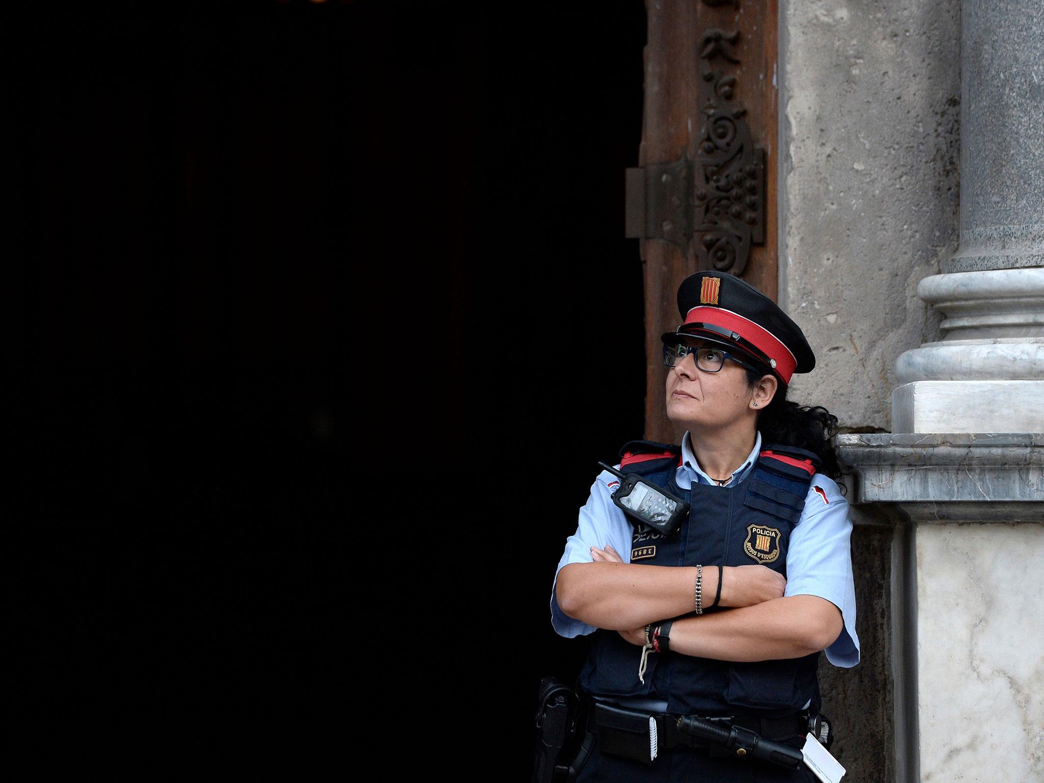 A police officer at the main entrance of the Generalitat palace in Barcelona