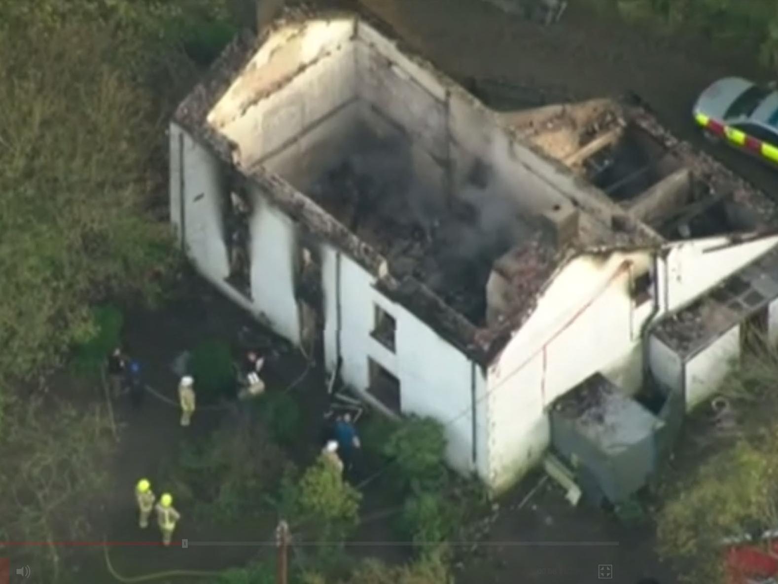 Aerial footage of the remains of the remains of the farmhouse at Llangammarch Wells, Powys, following the blaze at the remote property