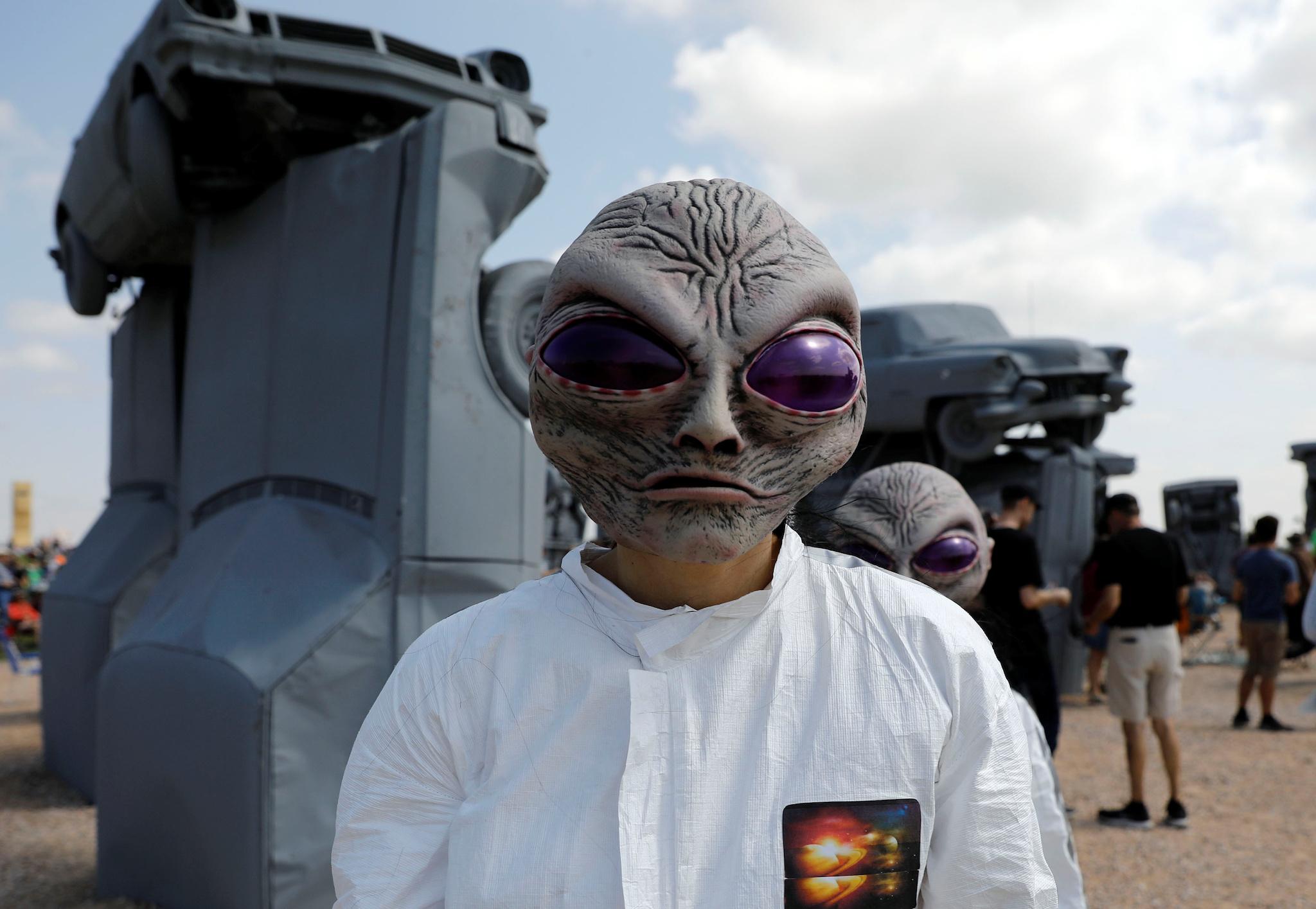 Meagan Shrewsbury and Kim Galyen dress as aliens during the solar eclipse