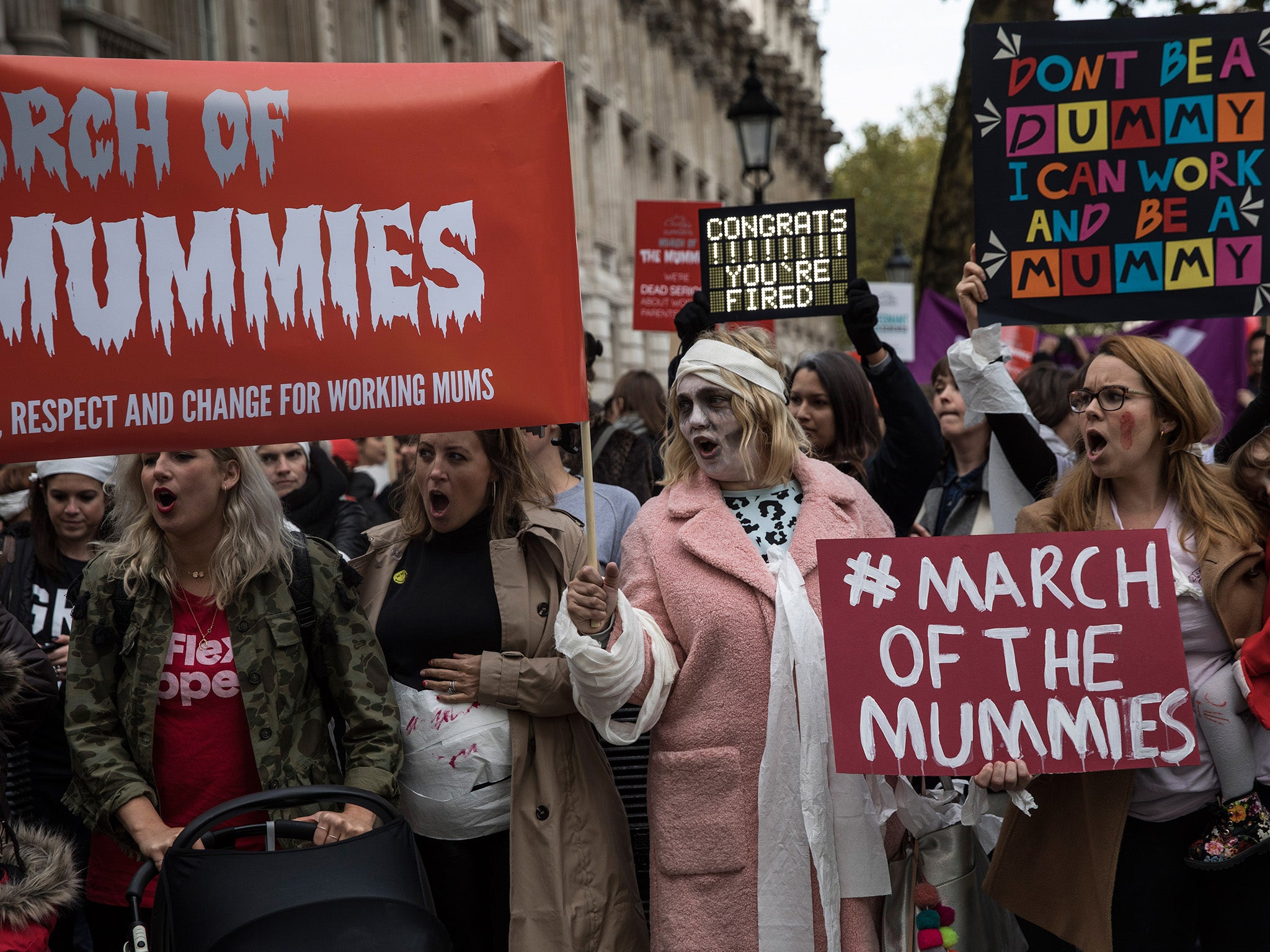 Women protest outside Downing Street as they join a demonstration demanding rights for working mothers