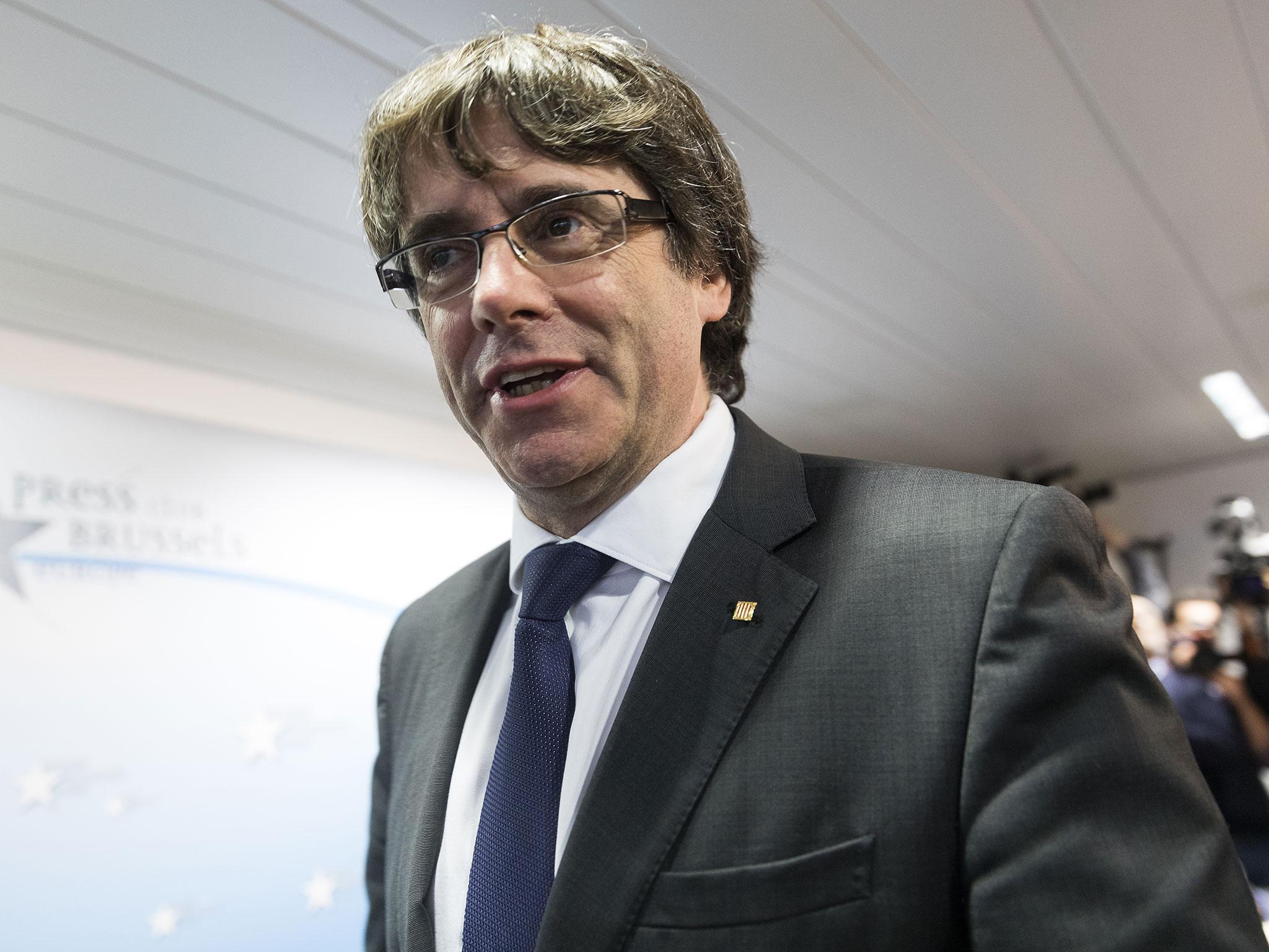 Dismissed Catalan regional President Carles Puigdemont attends a press conference at International Press Club of Brussels