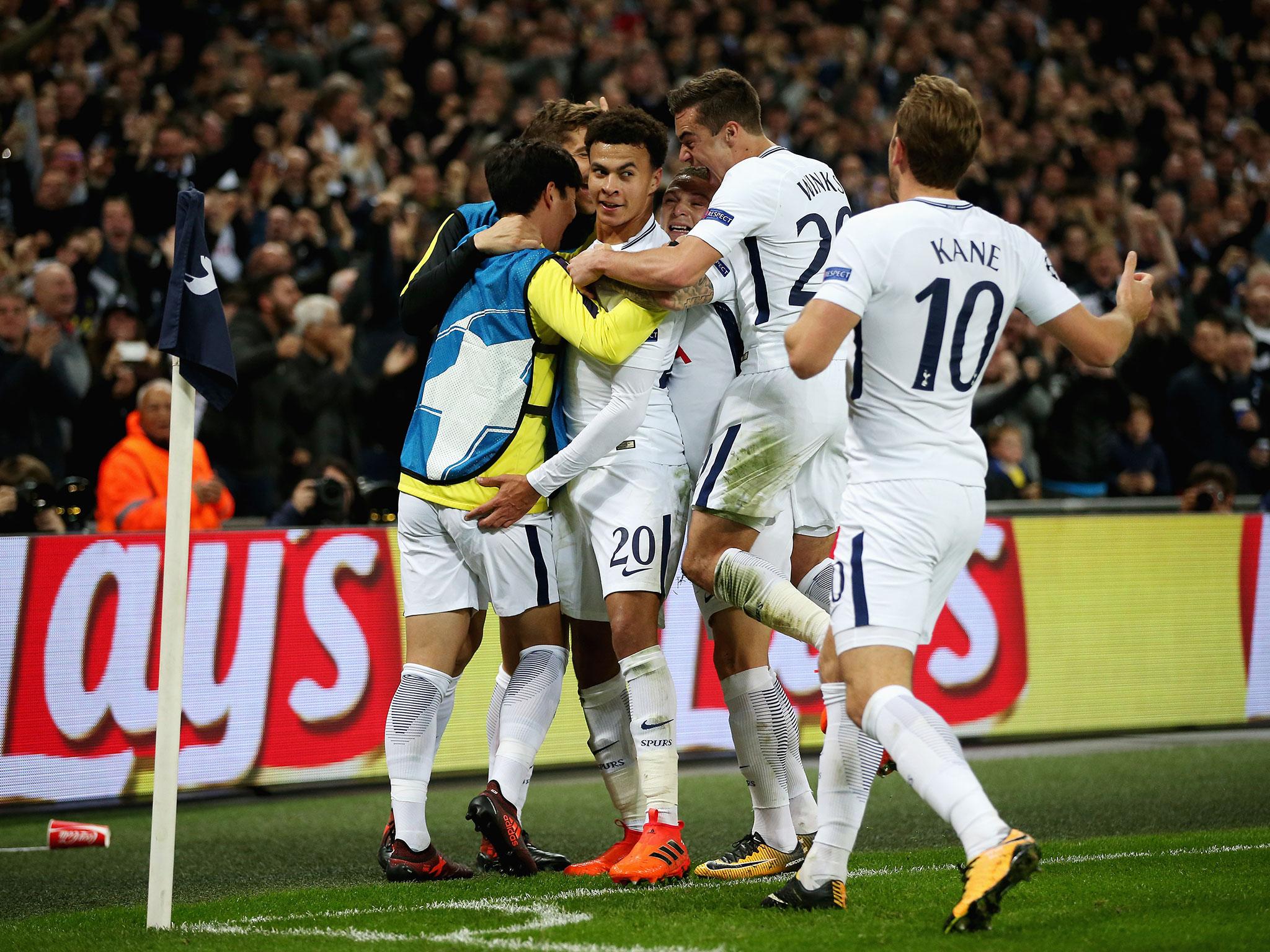 Tottenham's players celebrate with Alli after his second