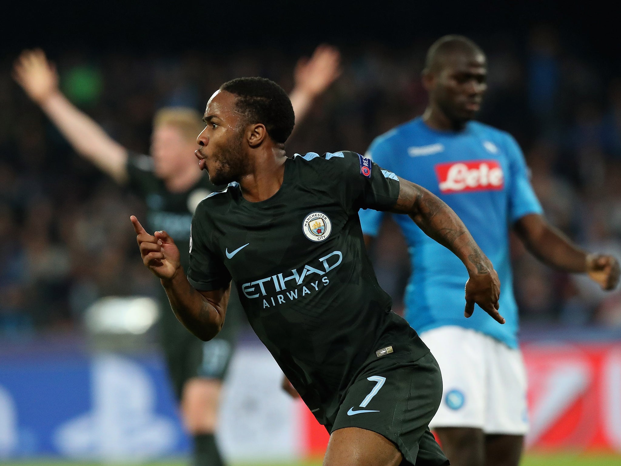 Sterling celebrates after scoring City's fourth goal against Napoli