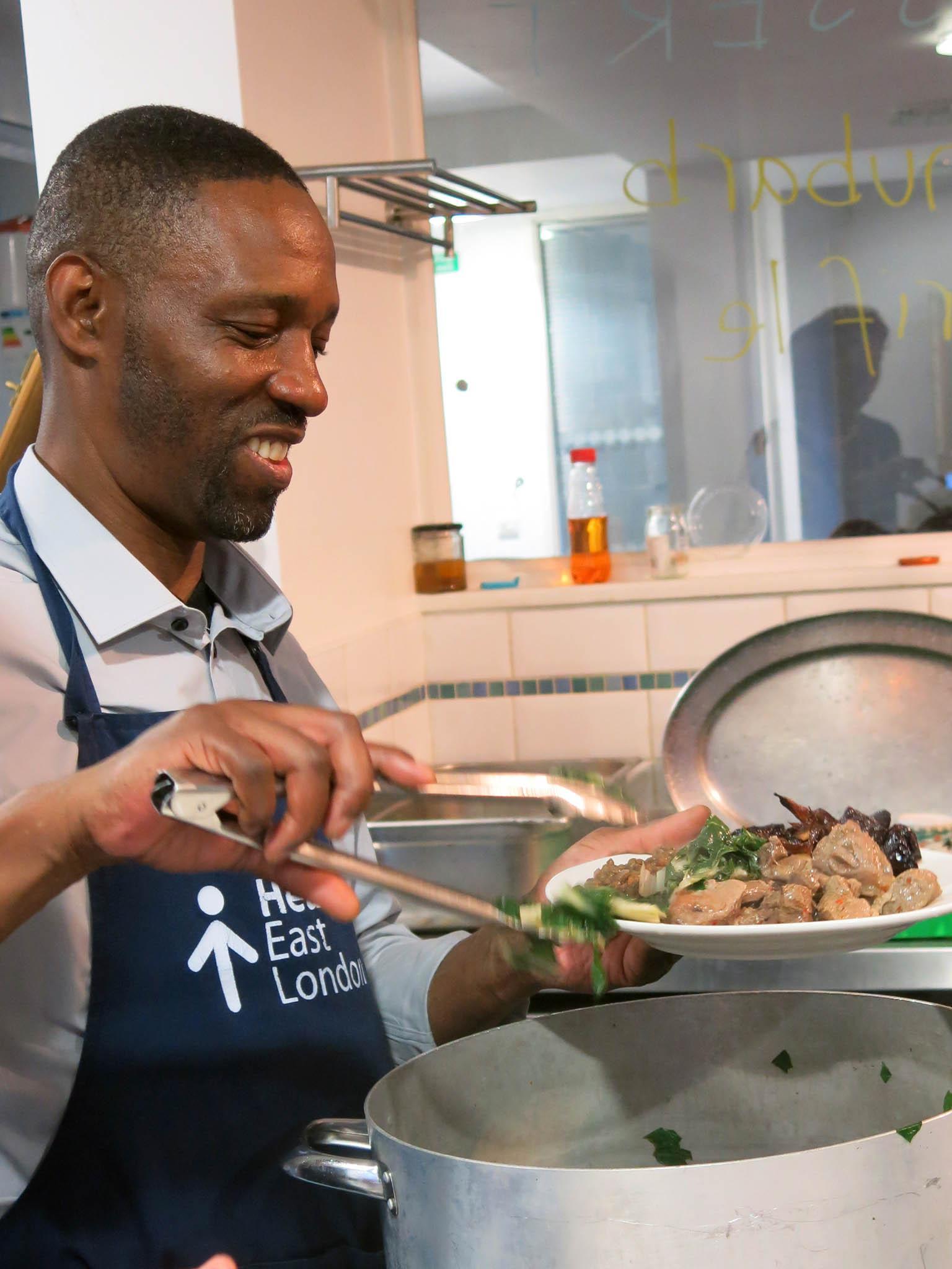 Keith dishes up the main course at one of Headway East London's supper clubs