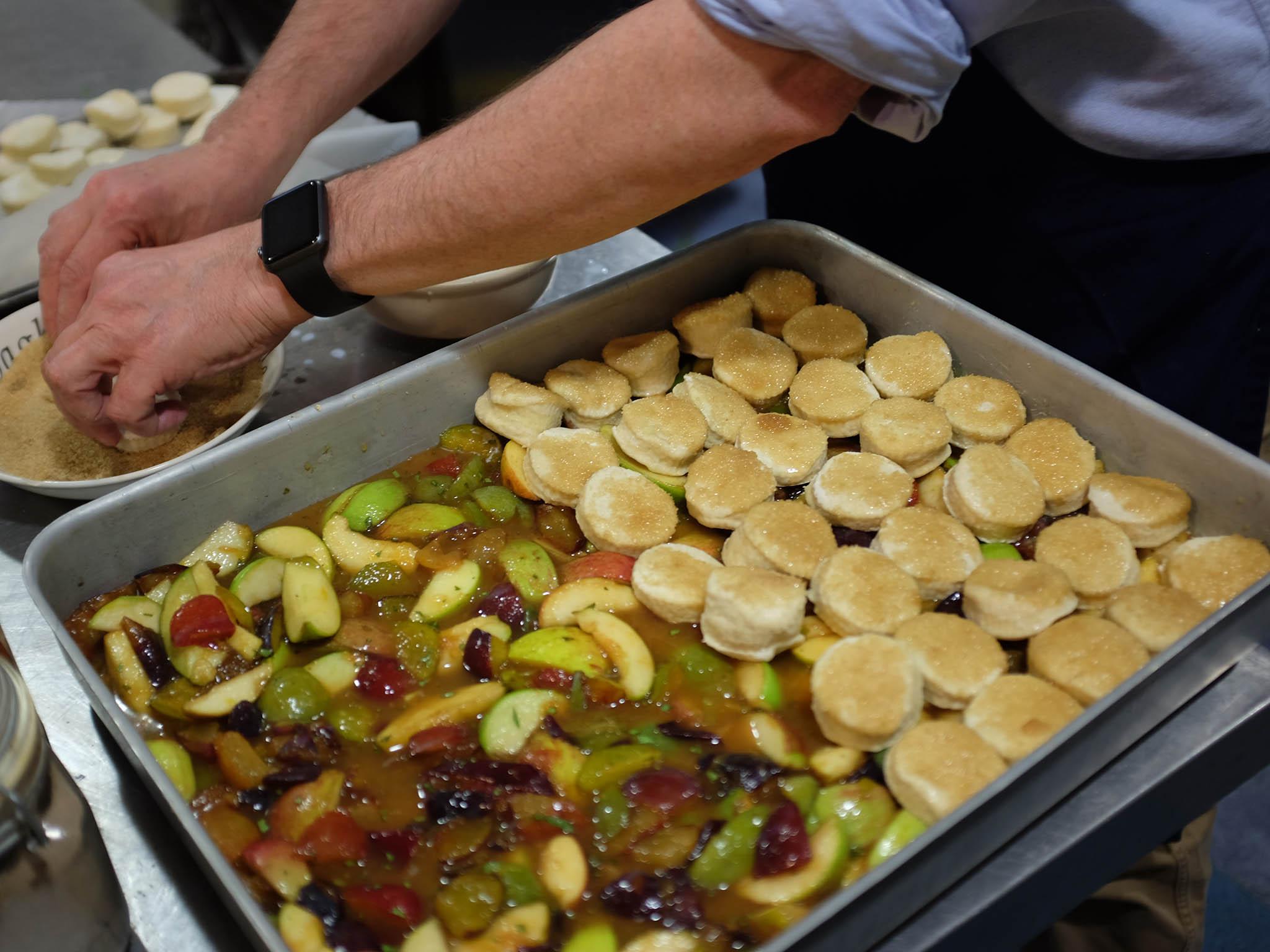 The team prepping the fruit cobbler for the dessert