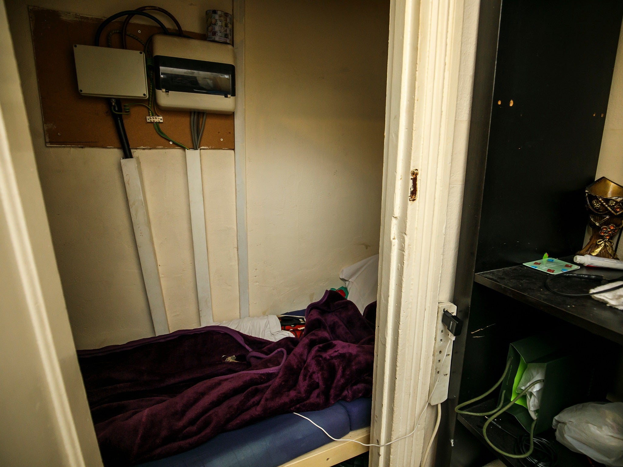 The "coffin-like" understairs cupboard was being used as a room in the crowded house in Beckton