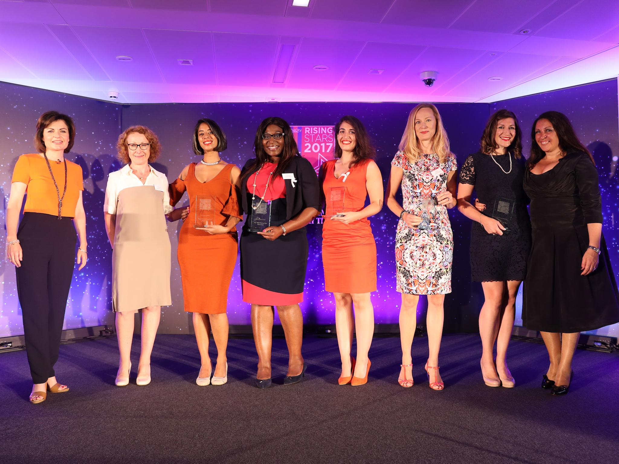 Ms Kamar, fourth from right, receives a rising star award from WeAreTheCity, an organisation supporting women