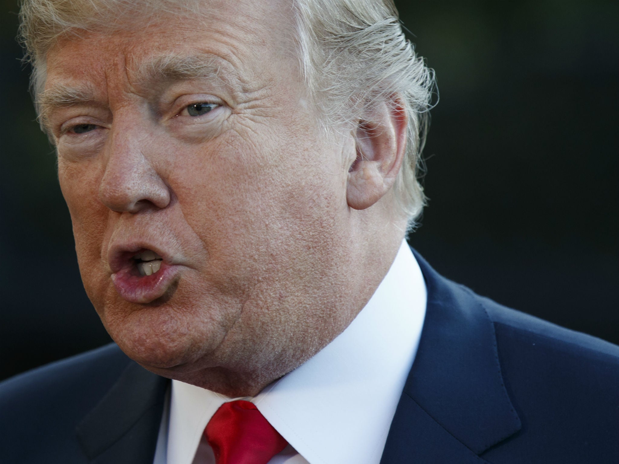 President Donald Trump speaks with reporters before departing the White House for a trip to Asia, Friday, Nov. 3, 2017, in Washington