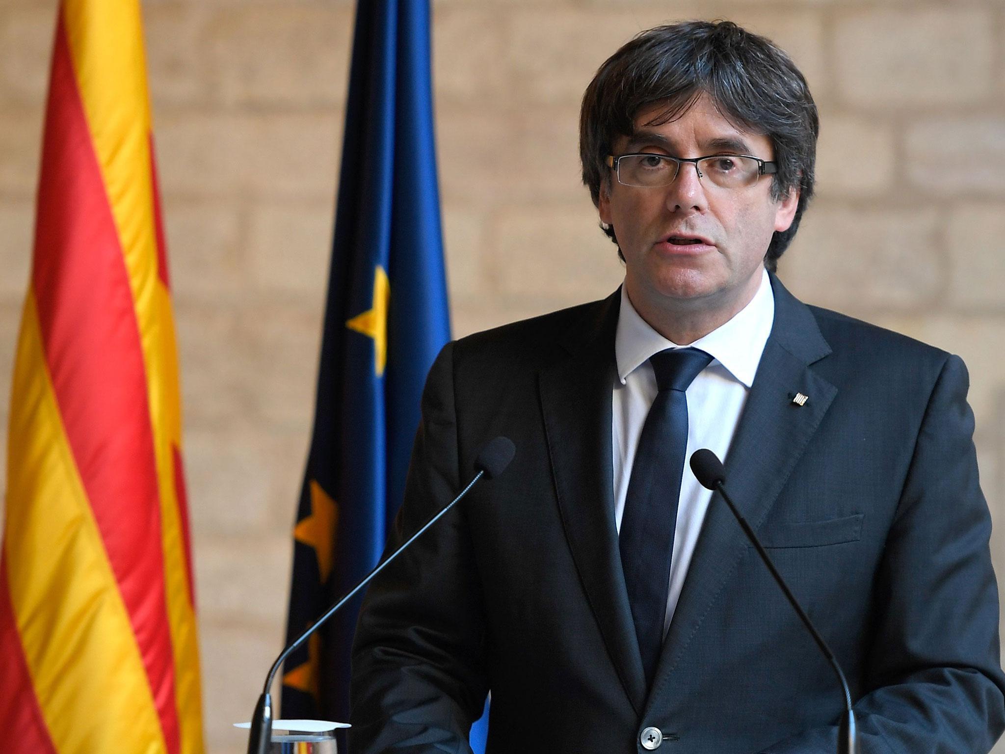 Carles Puigdemont handed himself to police in Brussels after an international arrest warrant was issued for him