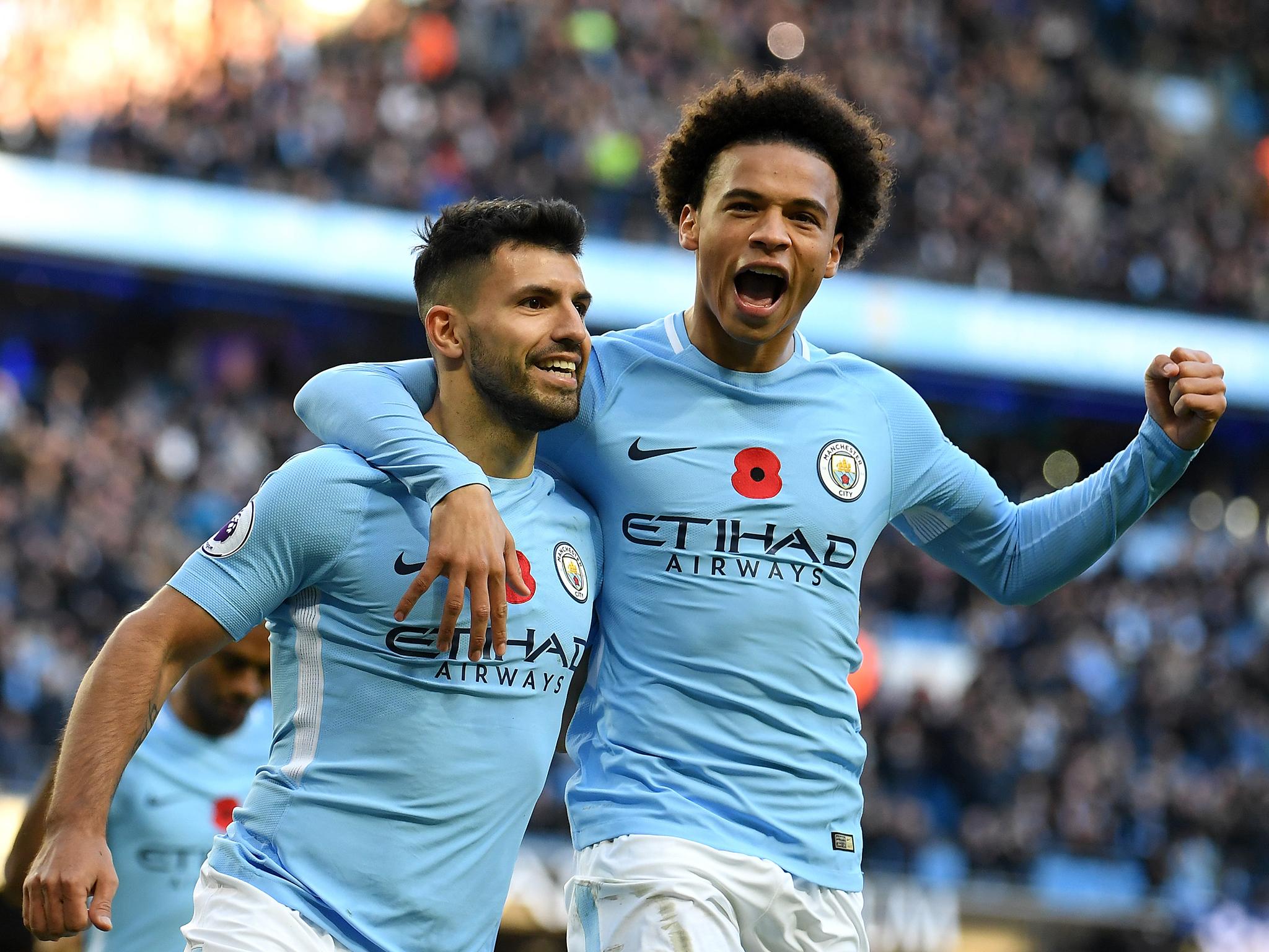 Sergio Aguero celebrates with Leroy Sane after scoring a penalty