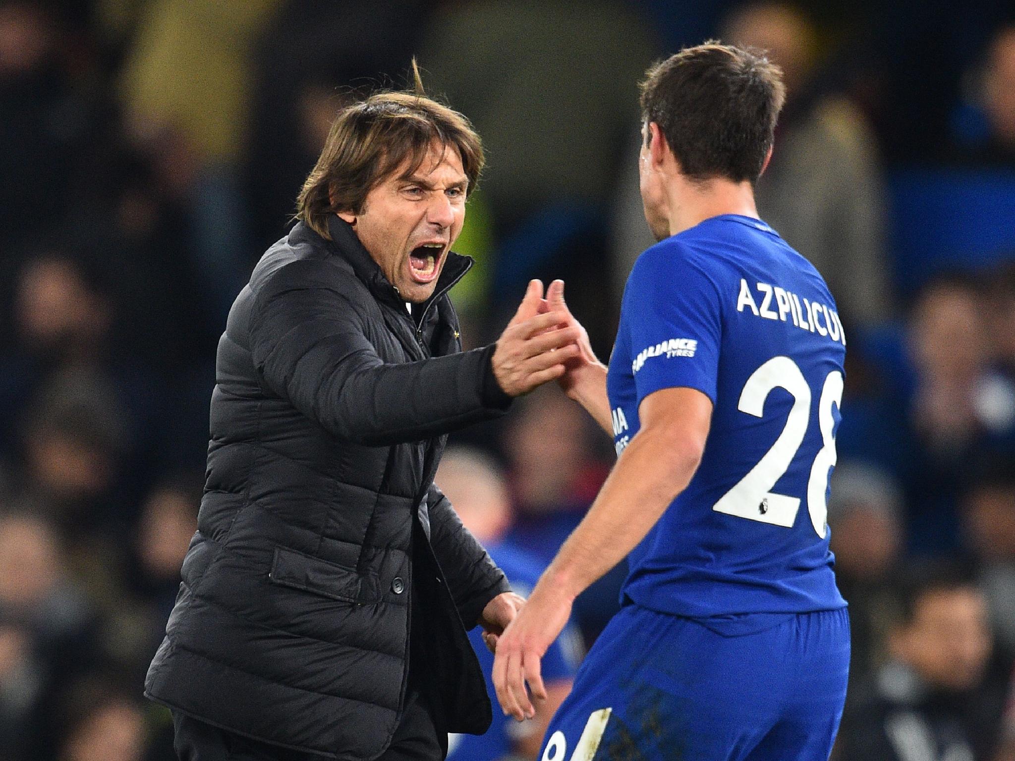 Antonio Conte celebrates Chelsea's 1-0 victory over Manchester United with Cesar Azpilicueta