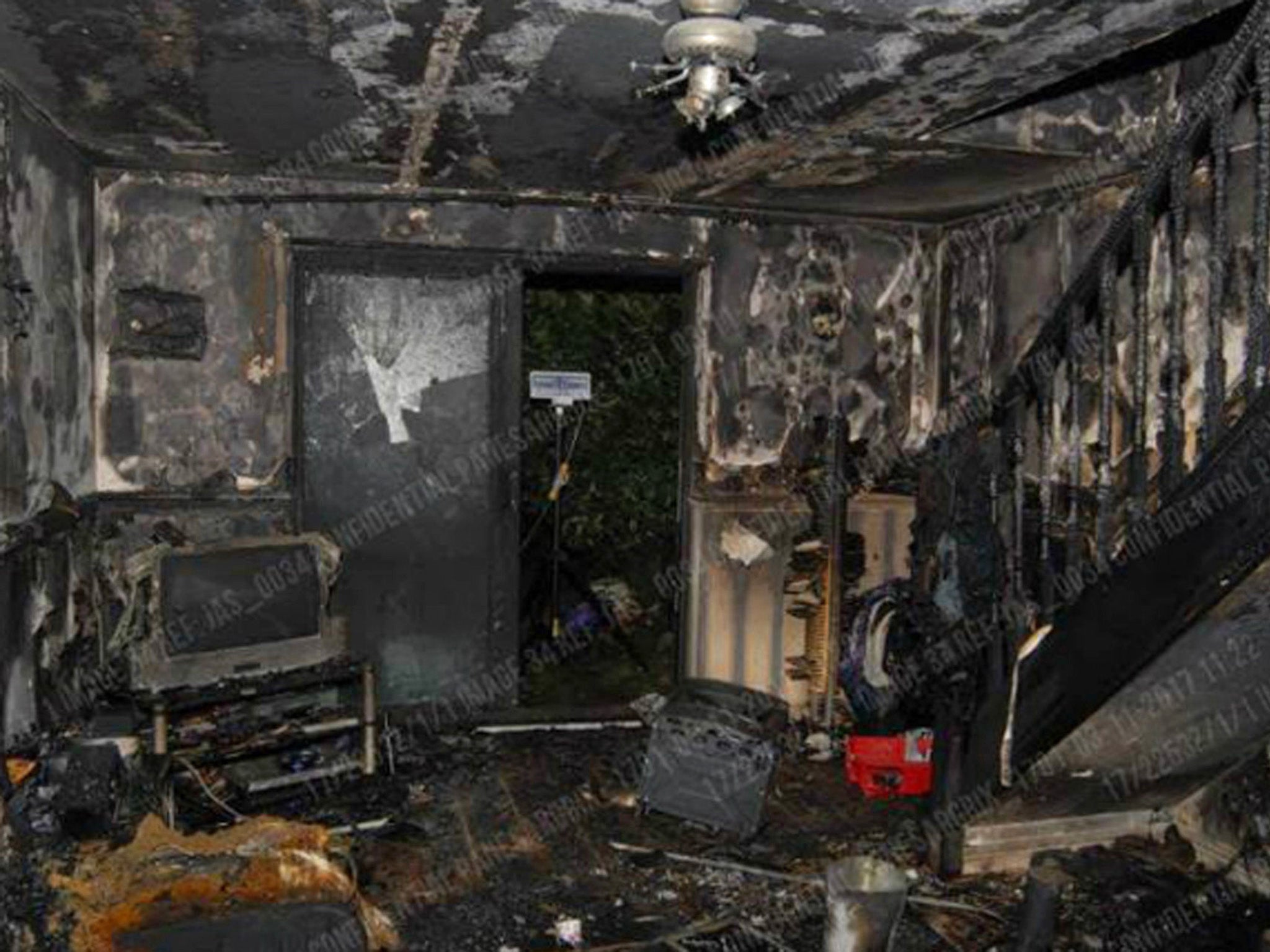 Handout photo issued by the West Midlands Police of firework damage inside Anthony Nicholls's property