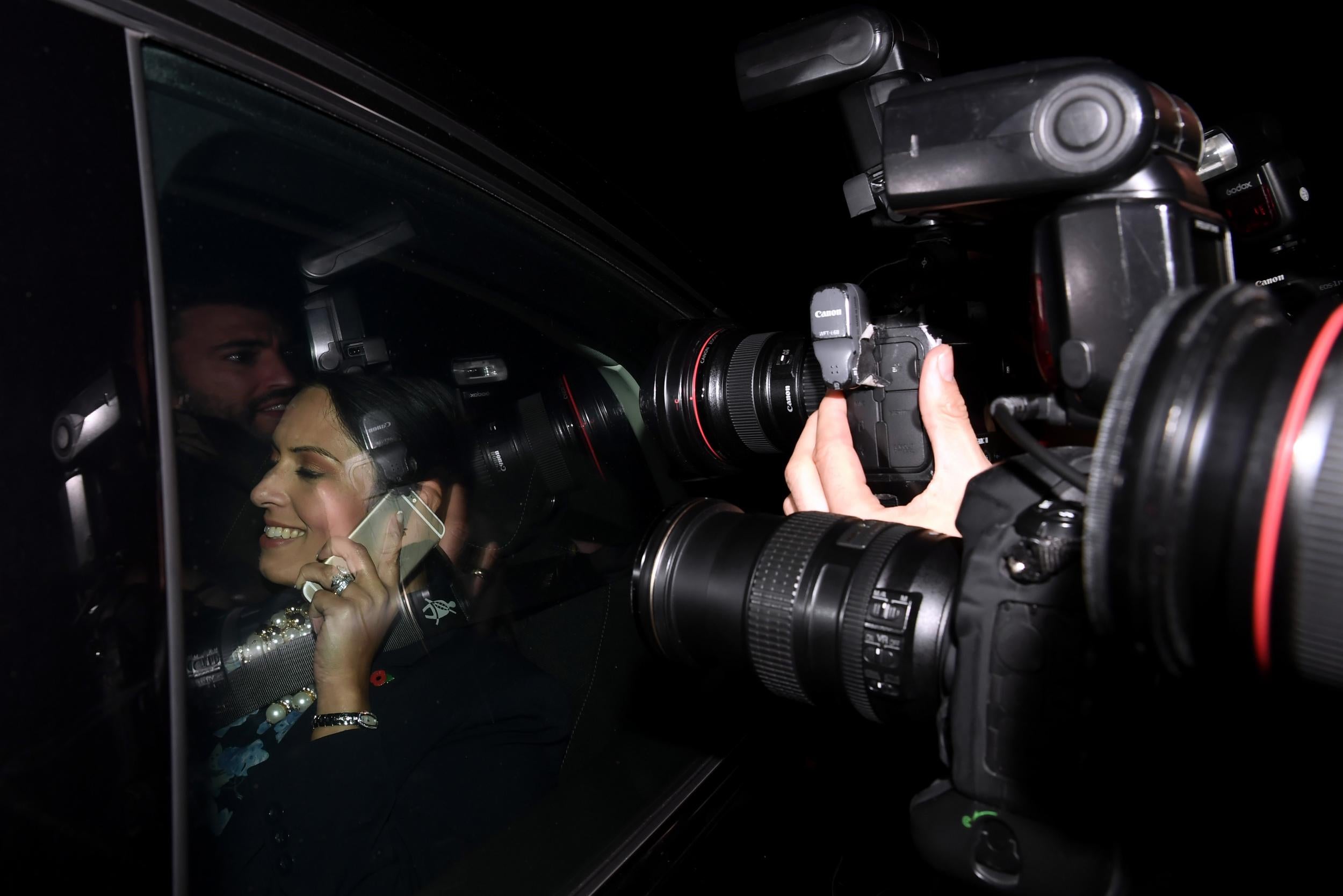 Priti Patel puts on a brave face as she leaves Downing Street