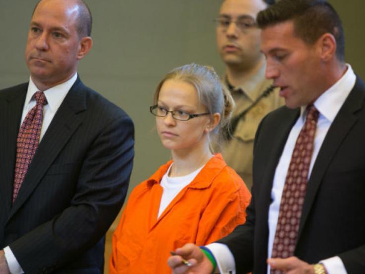 Angelika Graswald, centre, stands in court with her attorneys Jeffrey Chartier, left, and Richard Portale at her arraignment in Goshen