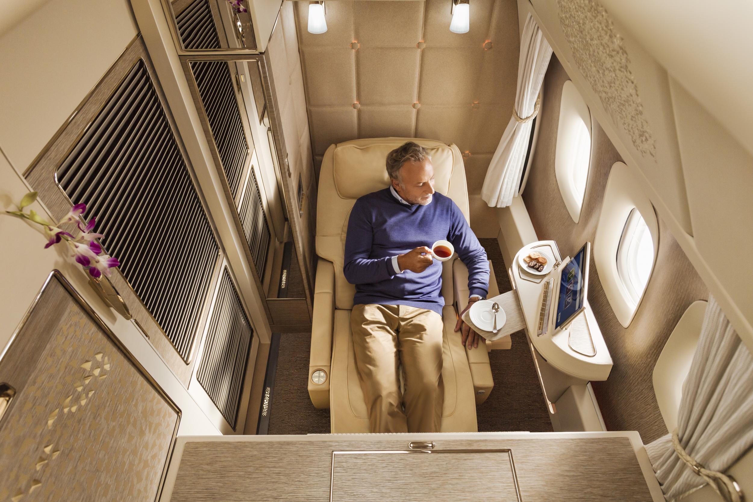 A traveller flying first class with Emirates