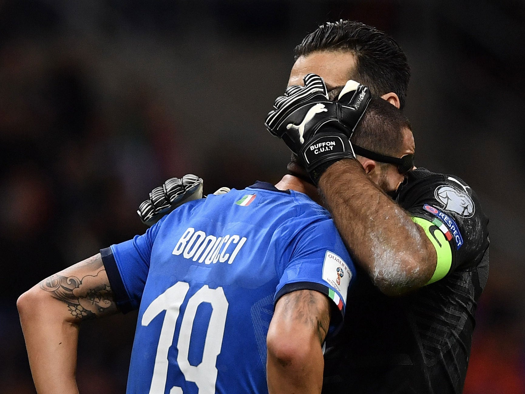 Gianluigi Buffon consoles Leonardo Bonucci after the final whistle