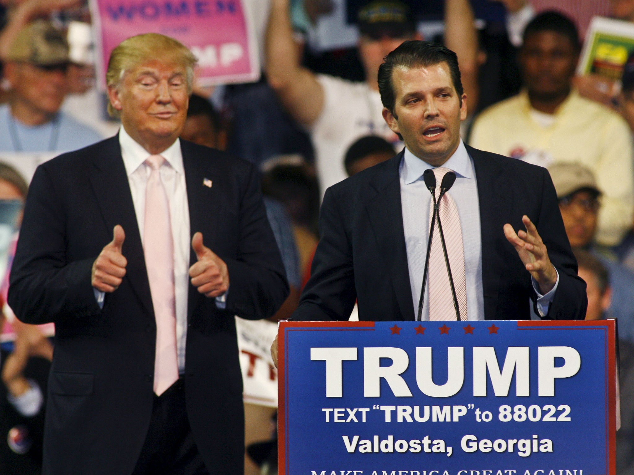 Donald Trump gives a thumbs up as his son Donald Trump, Jr. speaks at a campaign rally at Valdosta State University in Valdosta, Georgia February 29, 2016