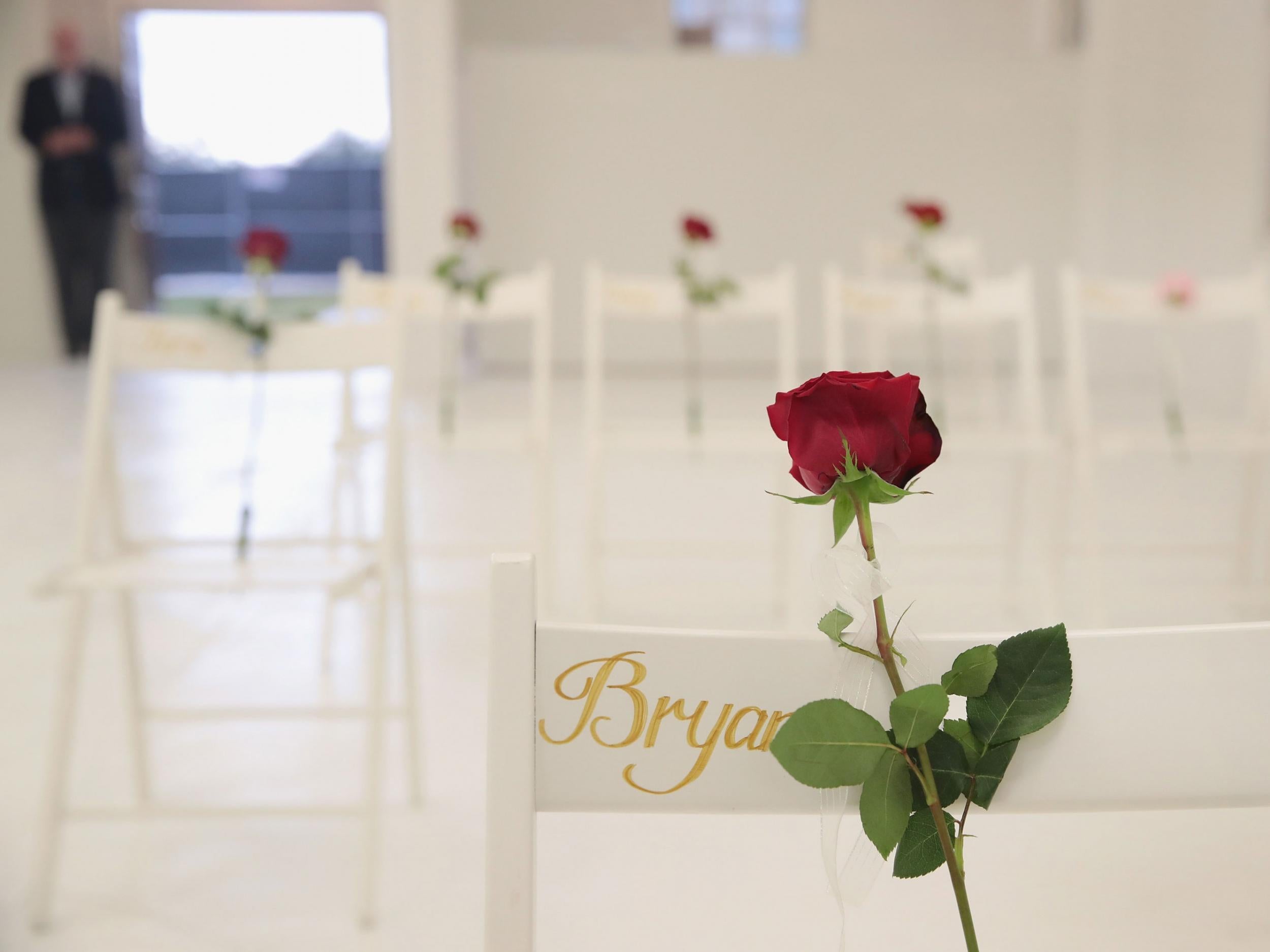 The inside of the church has been painted white with 26 white chairs placed around the room